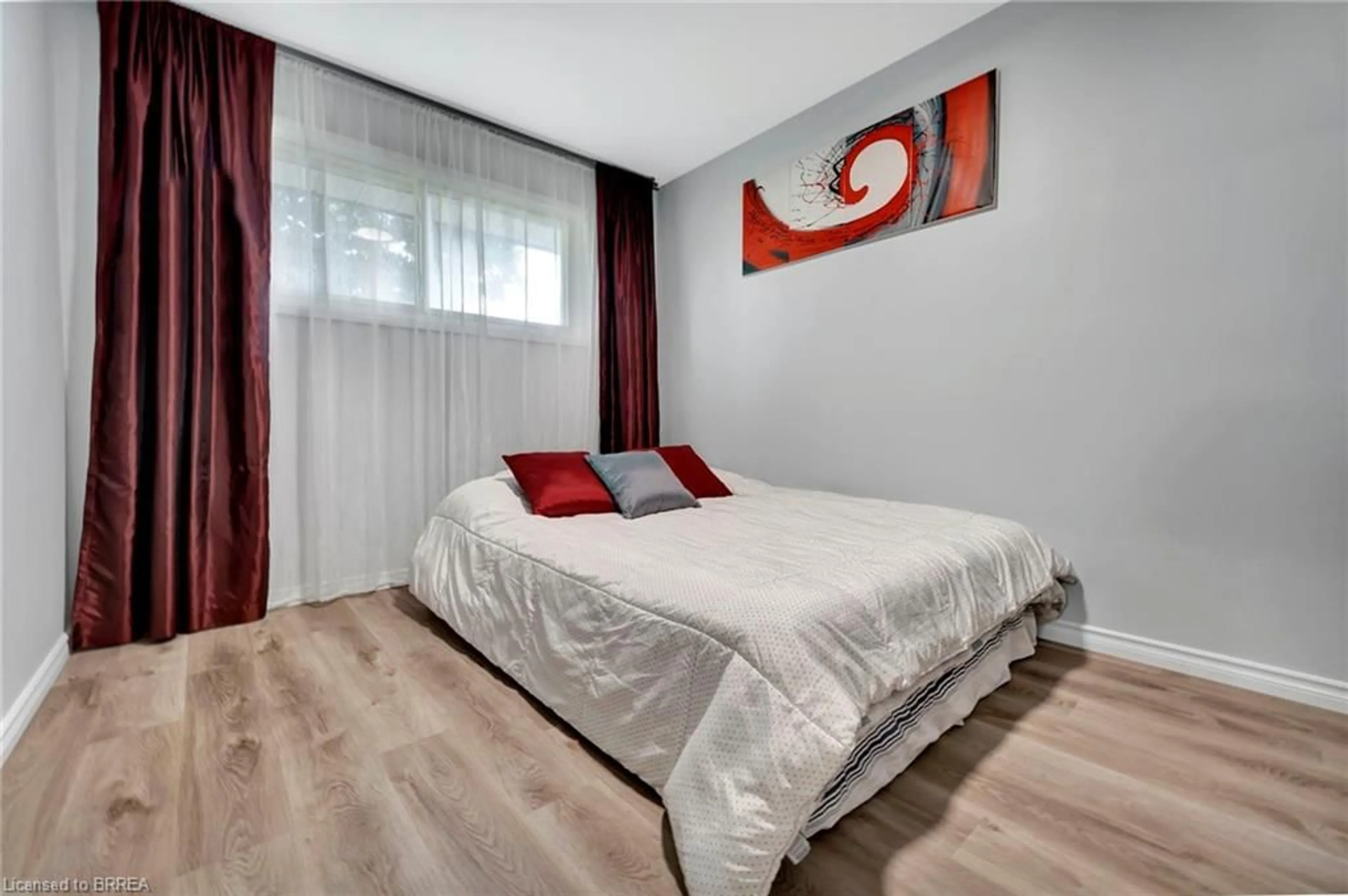 Bedroom with bed, wood/laminate floor for 4 Sixth Concession Rd, Burford Ontario N3T 5L7
