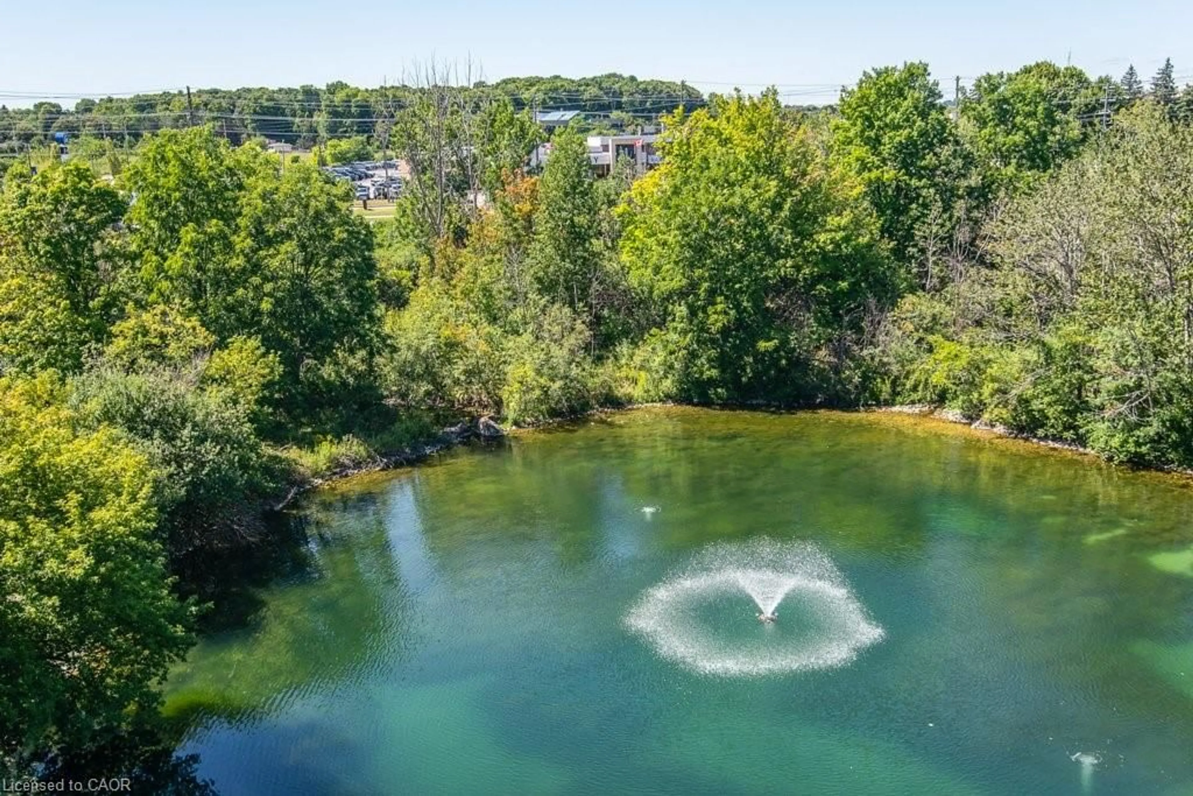 A pic from outside/outdoor area/front of a property/back of a property/a pic from drone, water/lake/river/ocean view for 30 Blue Springs Dr #501, Waterloo Ontario N2J 4T2