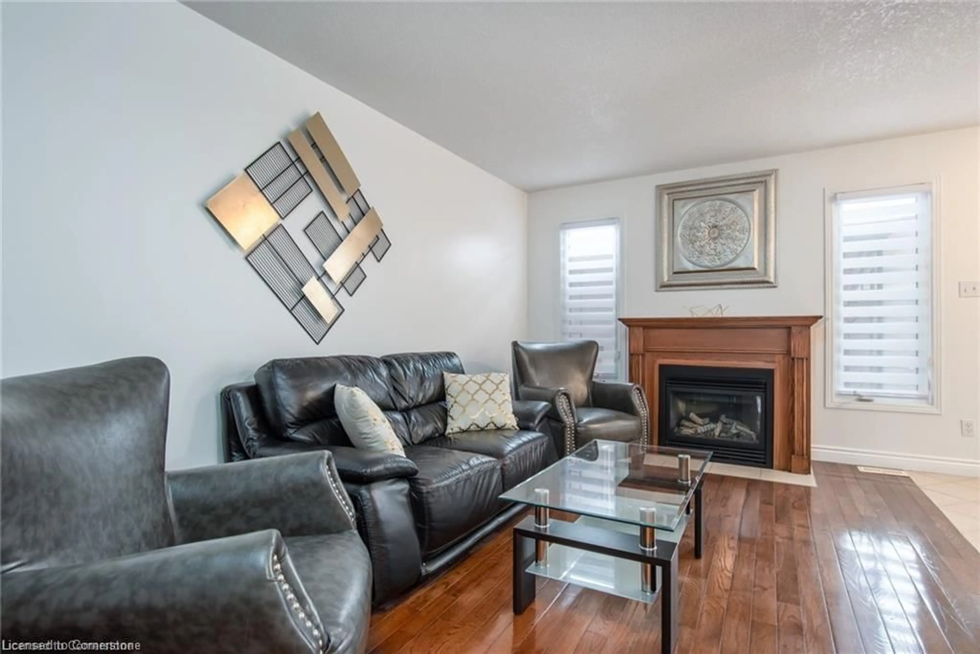 Living room with furniture, wood/laminate floor for 424 Wake Robin Cres, Kitchener Ontario N2E 3L6