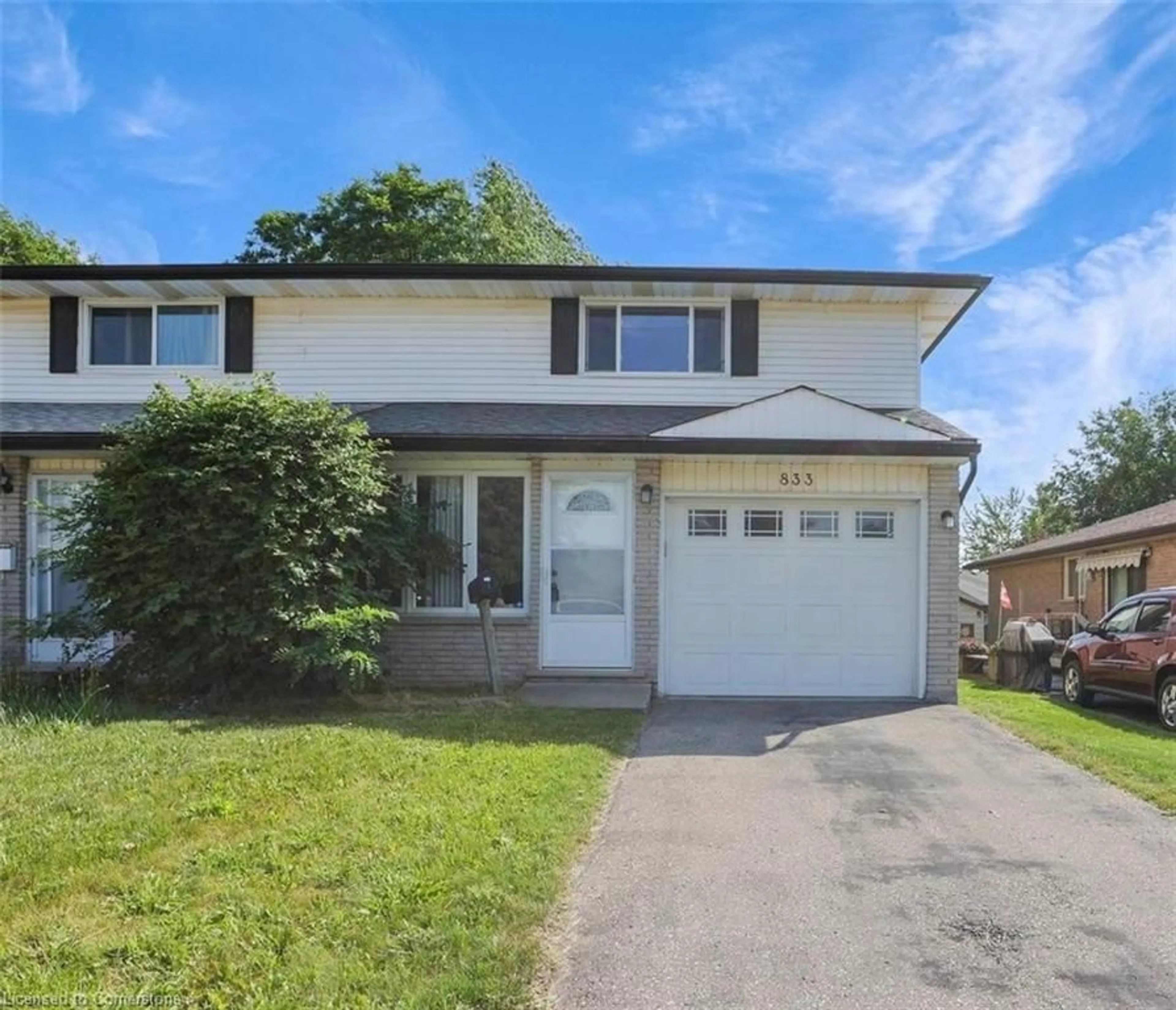 Home with vinyl exterior material, street for 833 Doon Village Rd, Kitchener Ontario N2P 1A1
