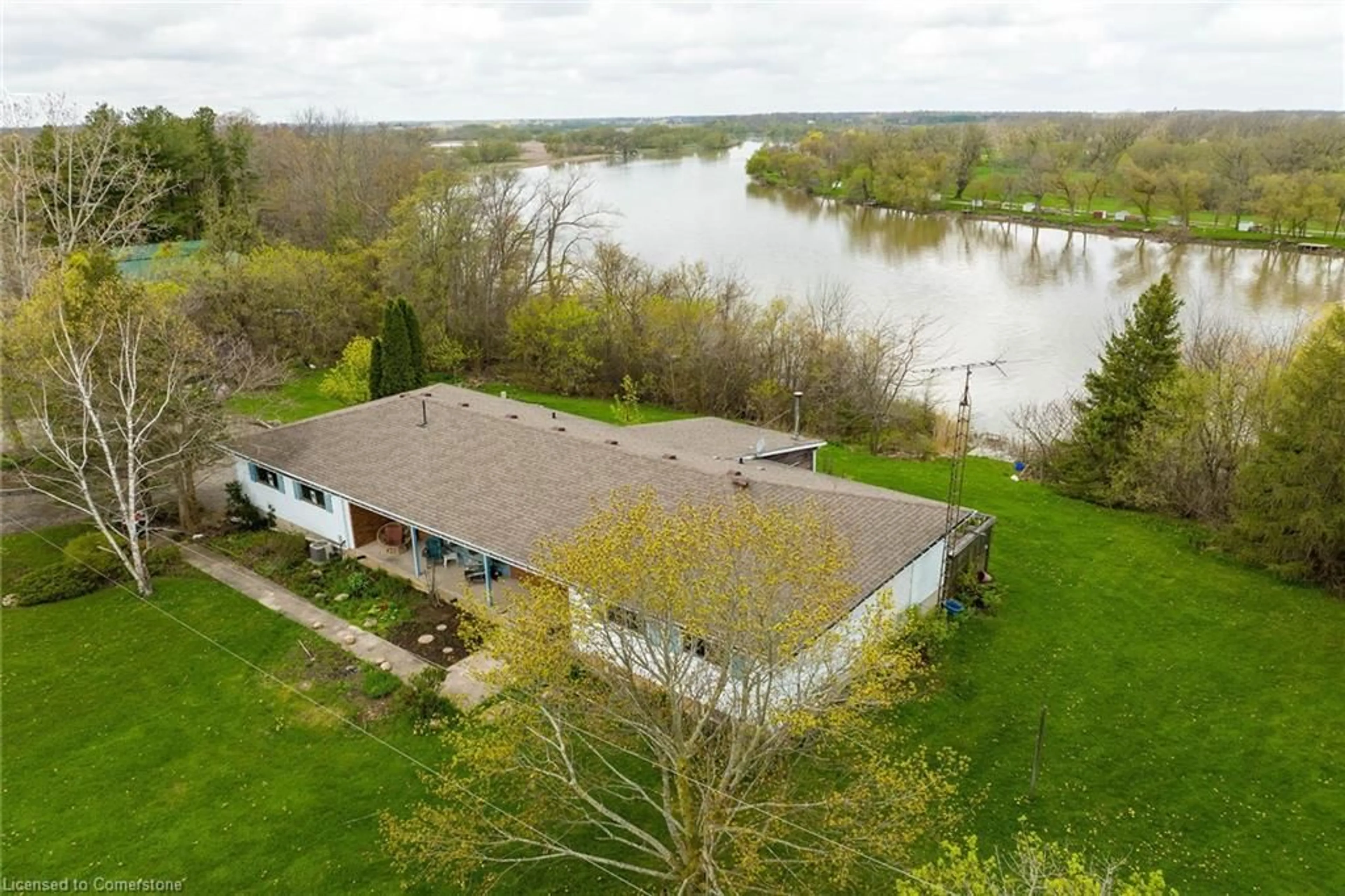 A pic from outside/outdoor area/front of a property/back of a property/a pic from drone, water/lake/river/ocean view for 304 River Rd, Haldimand County Ontario N1A 2W3