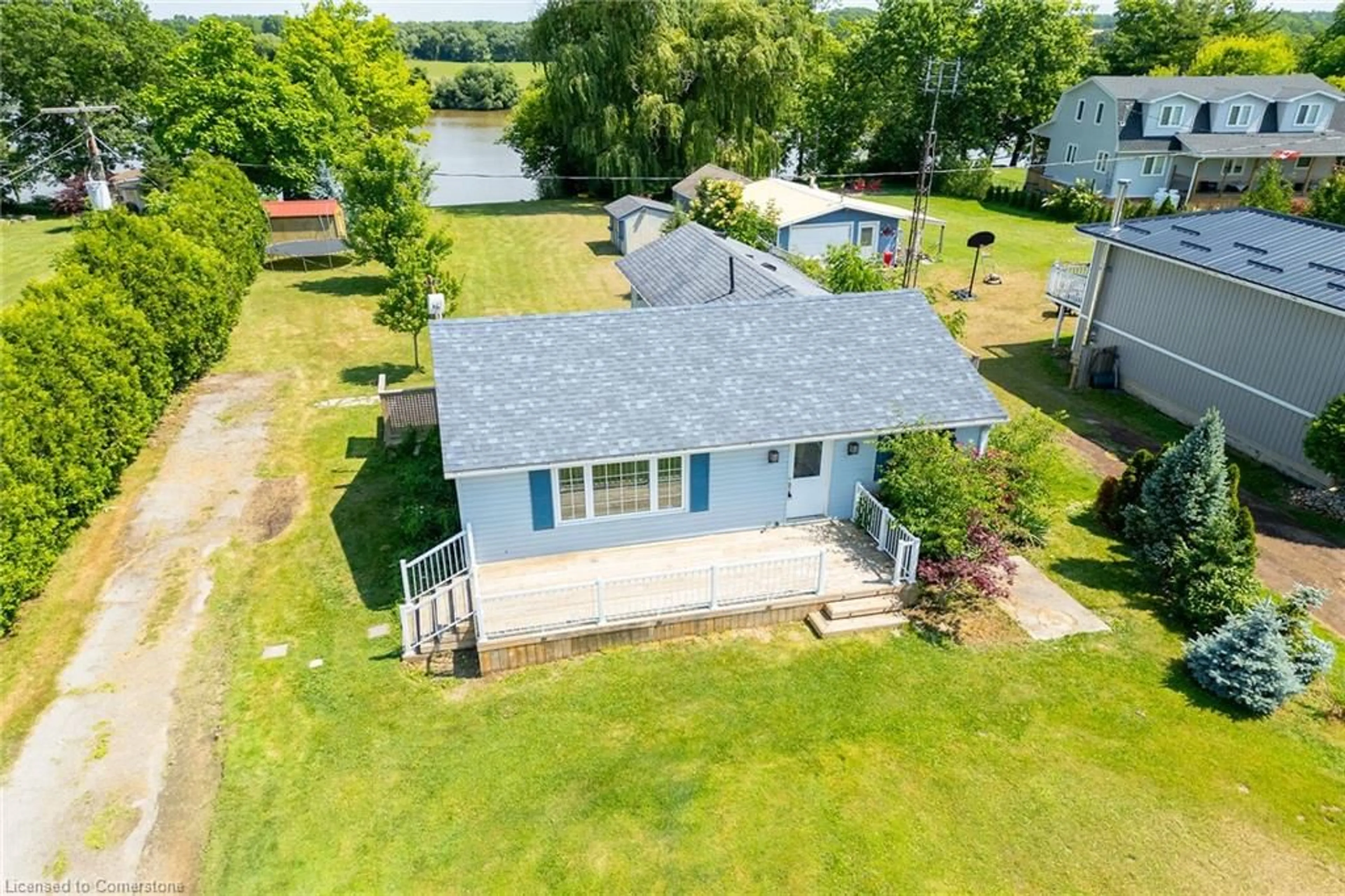 A pic from outside/outdoor area/front of a property/back of a property/a pic from drone, water/lake/river/ocean view for 1896 River Rd, Cayuga Ontario N0A 1E0