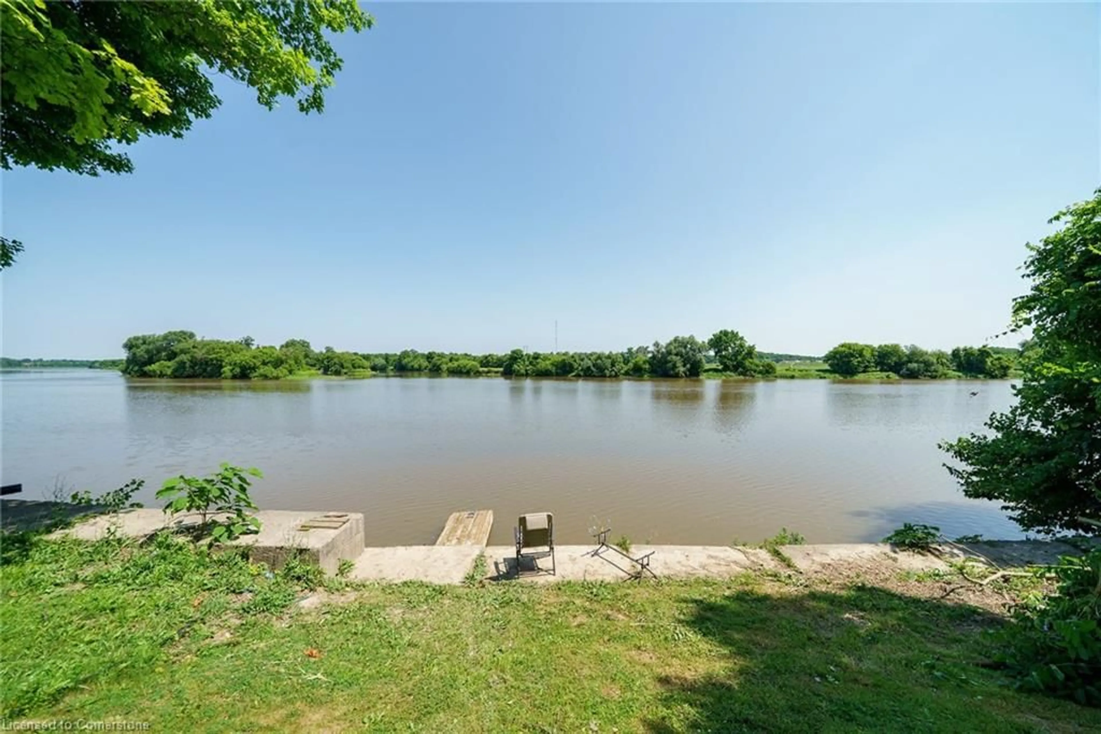 A pic from outside/outdoor area/front of a property/back of a property/a pic from drone, water/lake/river/ocean view for 1896 River Rd, Cayuga Ontario N0A 1E0