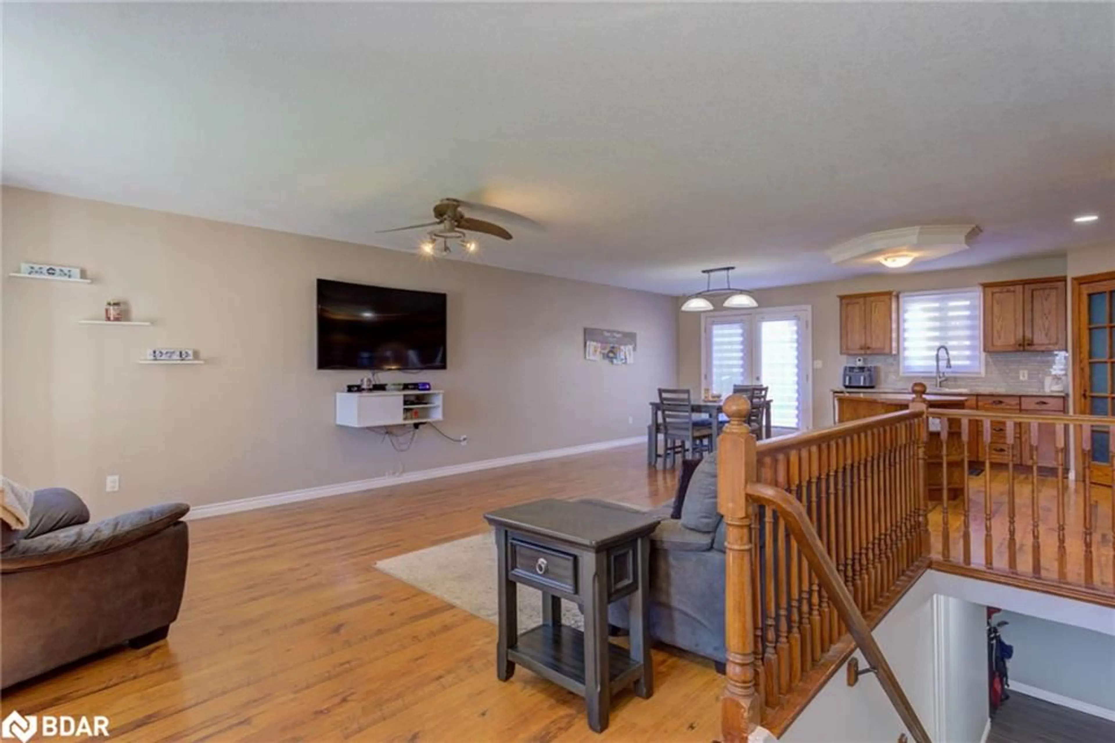 Living room with furniture, wood/laminate floor for 44 Geddes St, Clifford Ontario N0G 1M0