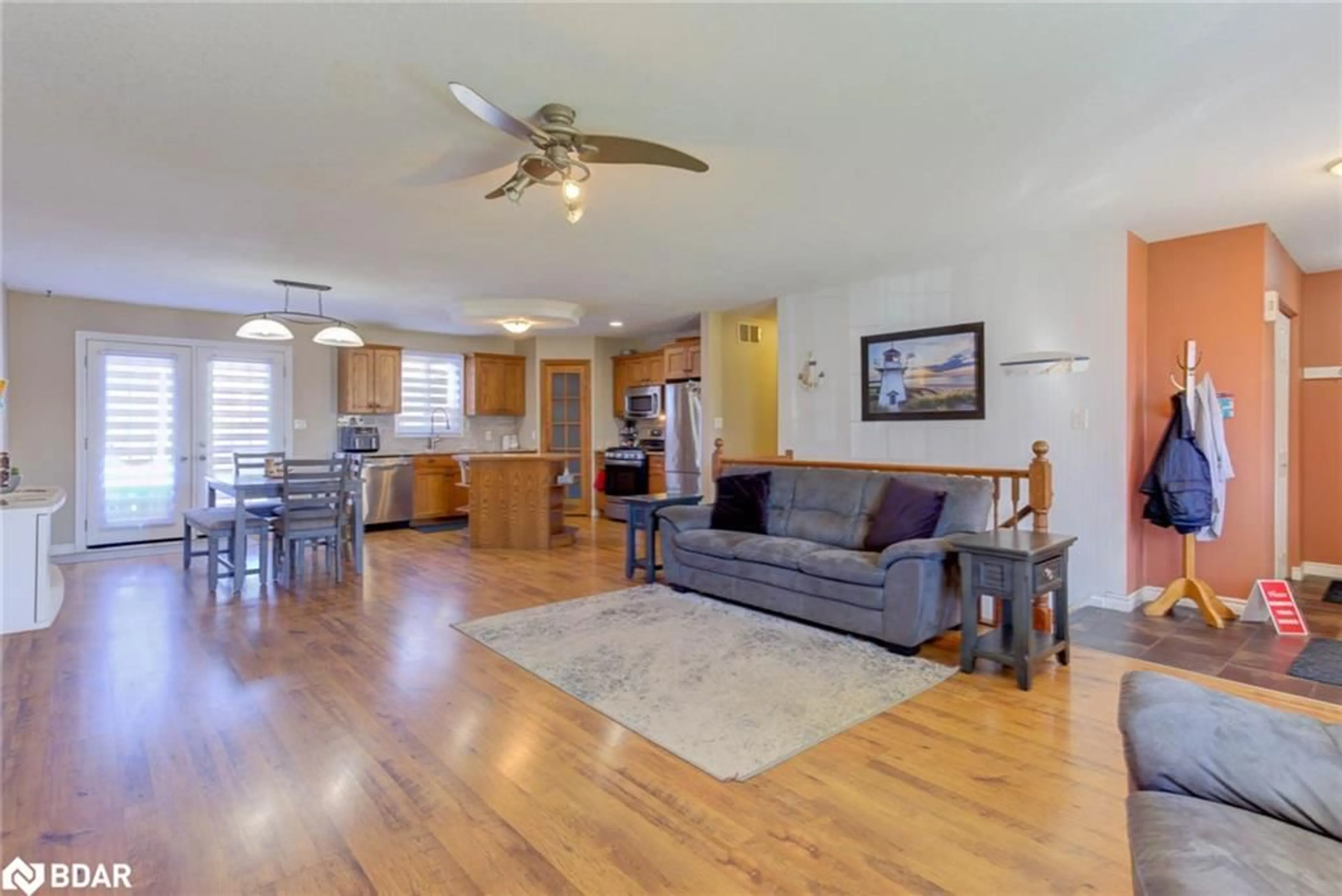 Living room with furniture, wood/laminate floor for 44 Geddes St, Clifford Ontario N0G 1M0
