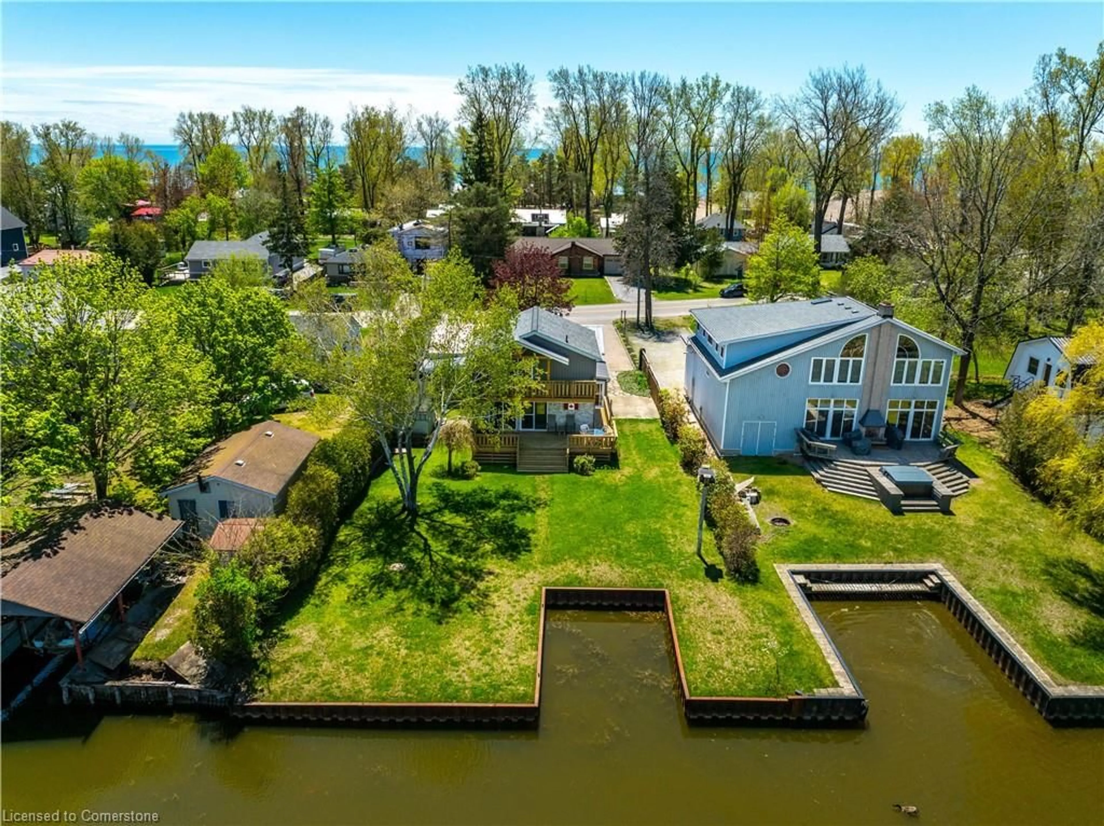 A pic from outside/outdoor area/front of a property/back of a property/a pic from drone, water/lake/river/ocean view for 270 Erie Blvd, Long Point Ontario N0E 1M0
