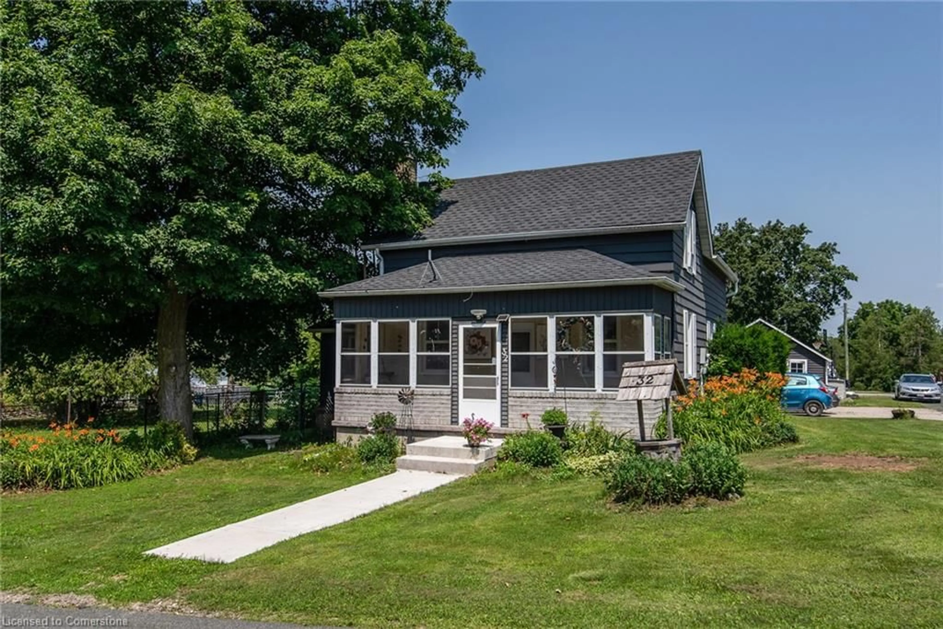 Home with vinyl exterior material, street for 32 River St, Bloomingdale Ontario N0B 1K0