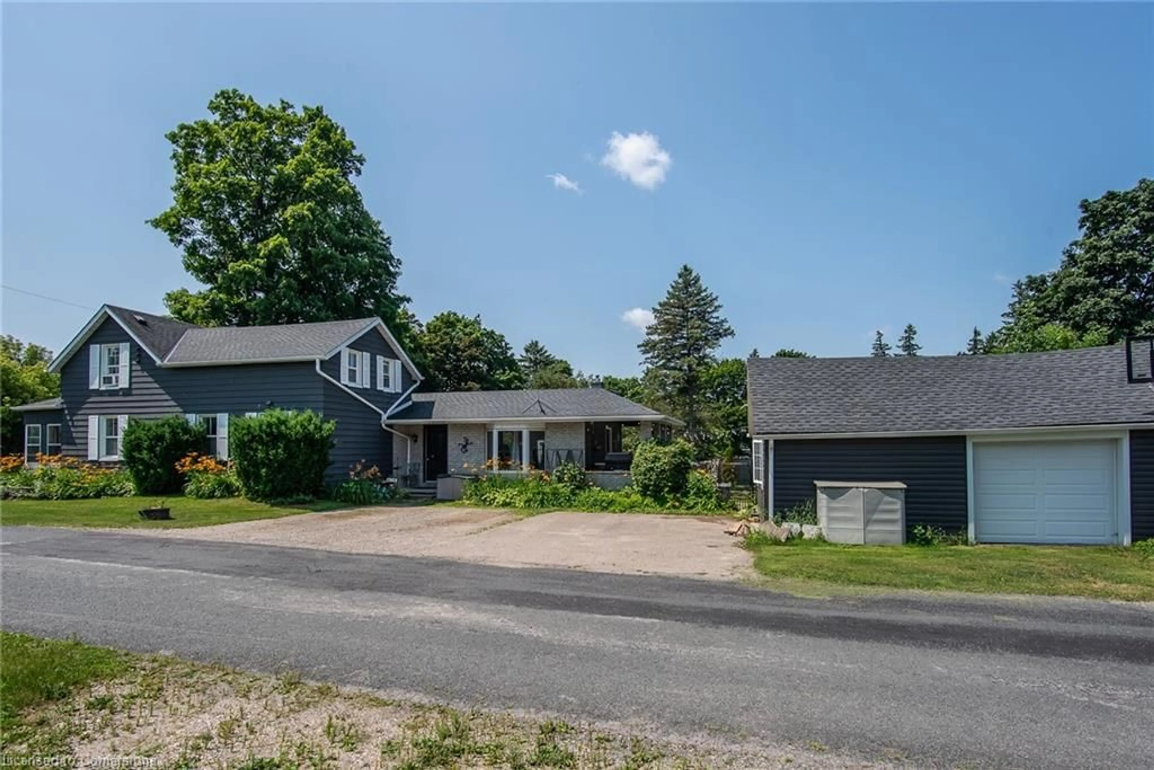 A pic from outside/outdoor area/front of a property/back of a property/a pic from drone, street for 32 River St, Bloomingdale Ontario N0B 1K0
