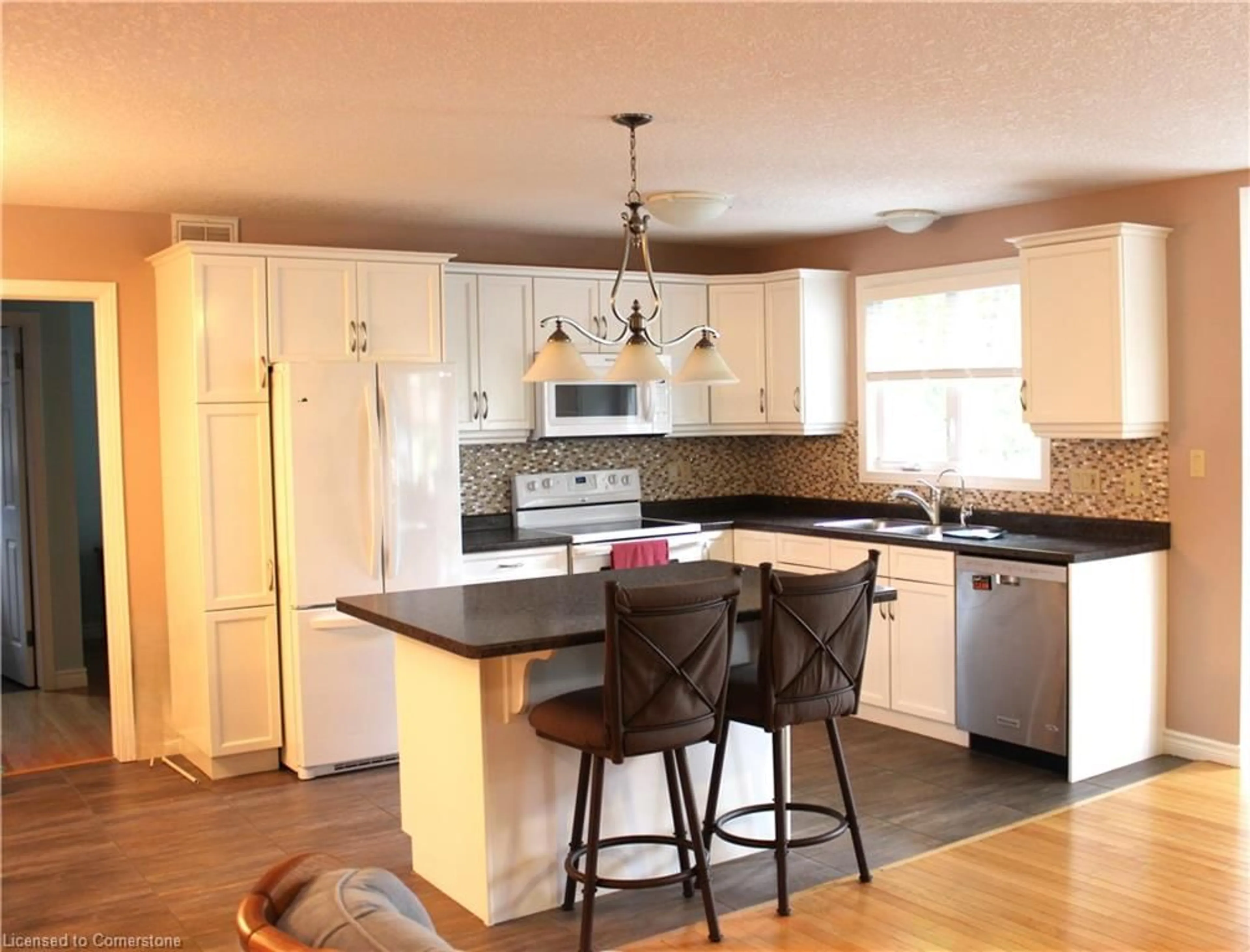 Open concept kitchen, wood/laminate floor for 72 Stanley Cres, Elora Ontario N0B 1S0