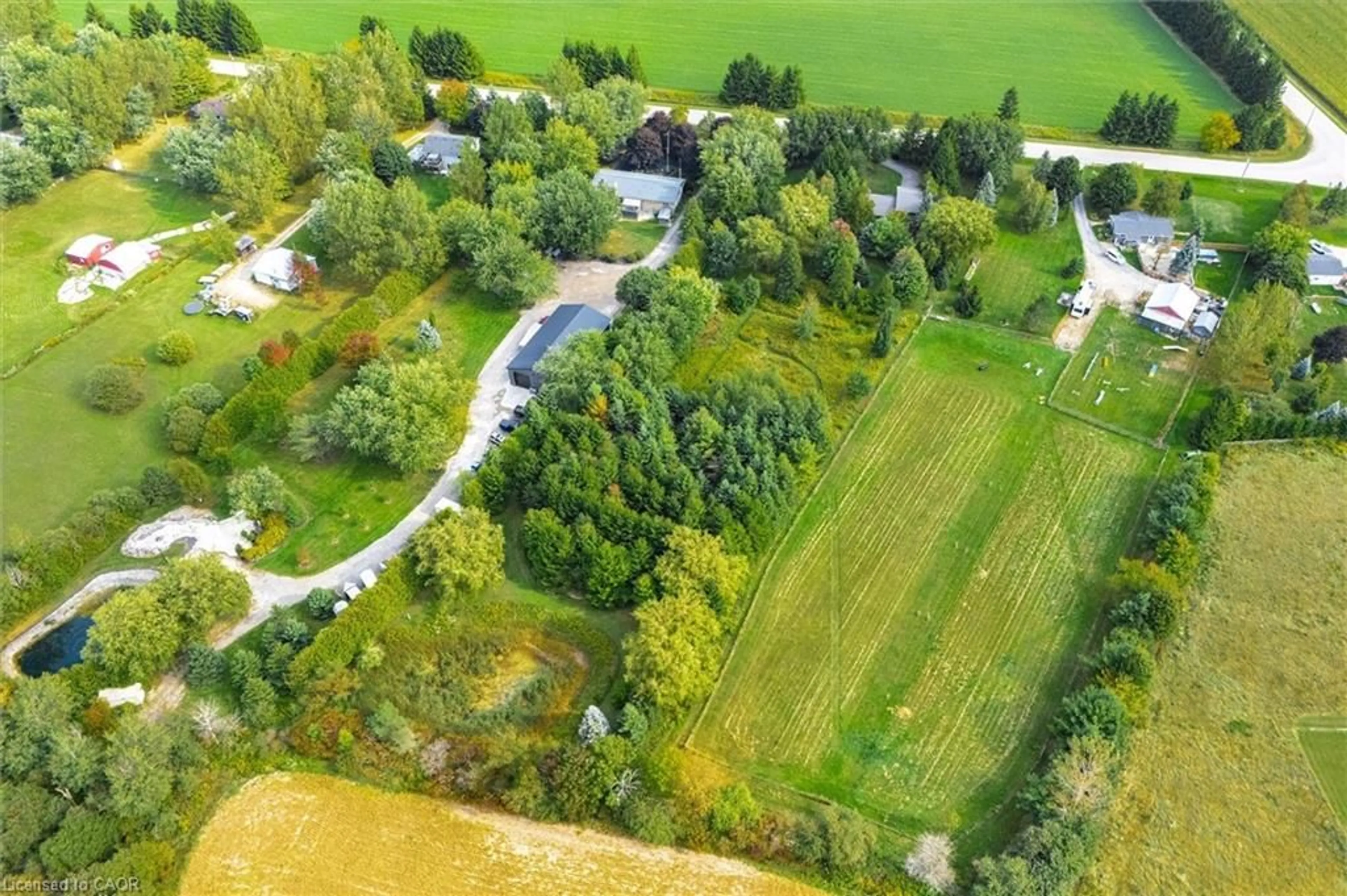 A pic from outside/outdoor area/front of a property/back of a property/a pic from drone, unknown for 7728 21 Sideroad, Mapleton Ontario N0G 1A0