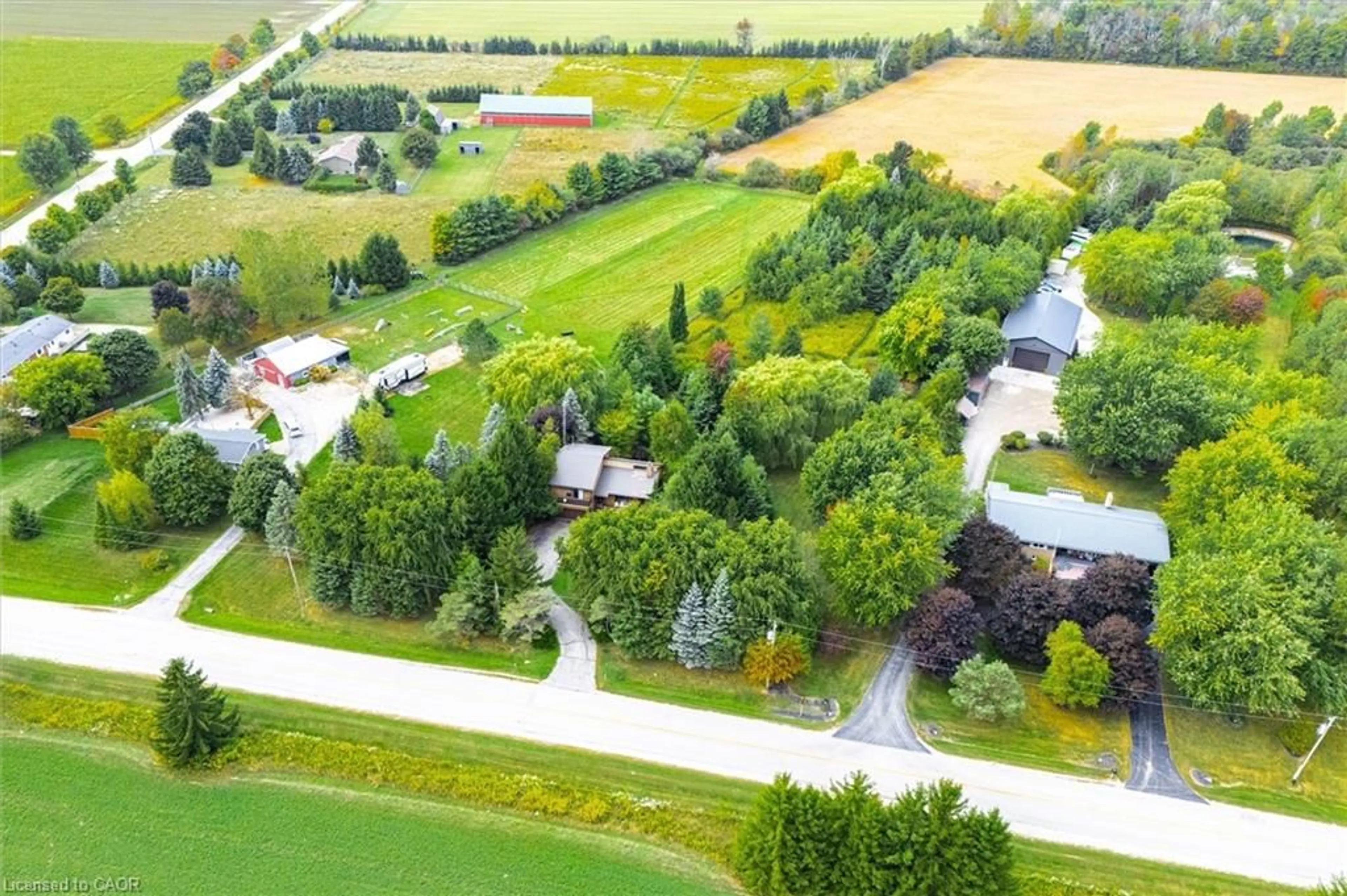 A pic from outside/outdoor area/front of a property/back of a property/a pic from drone, unknown for 7728 21 Sideroad, Mapleton Ontario N0G 1A0