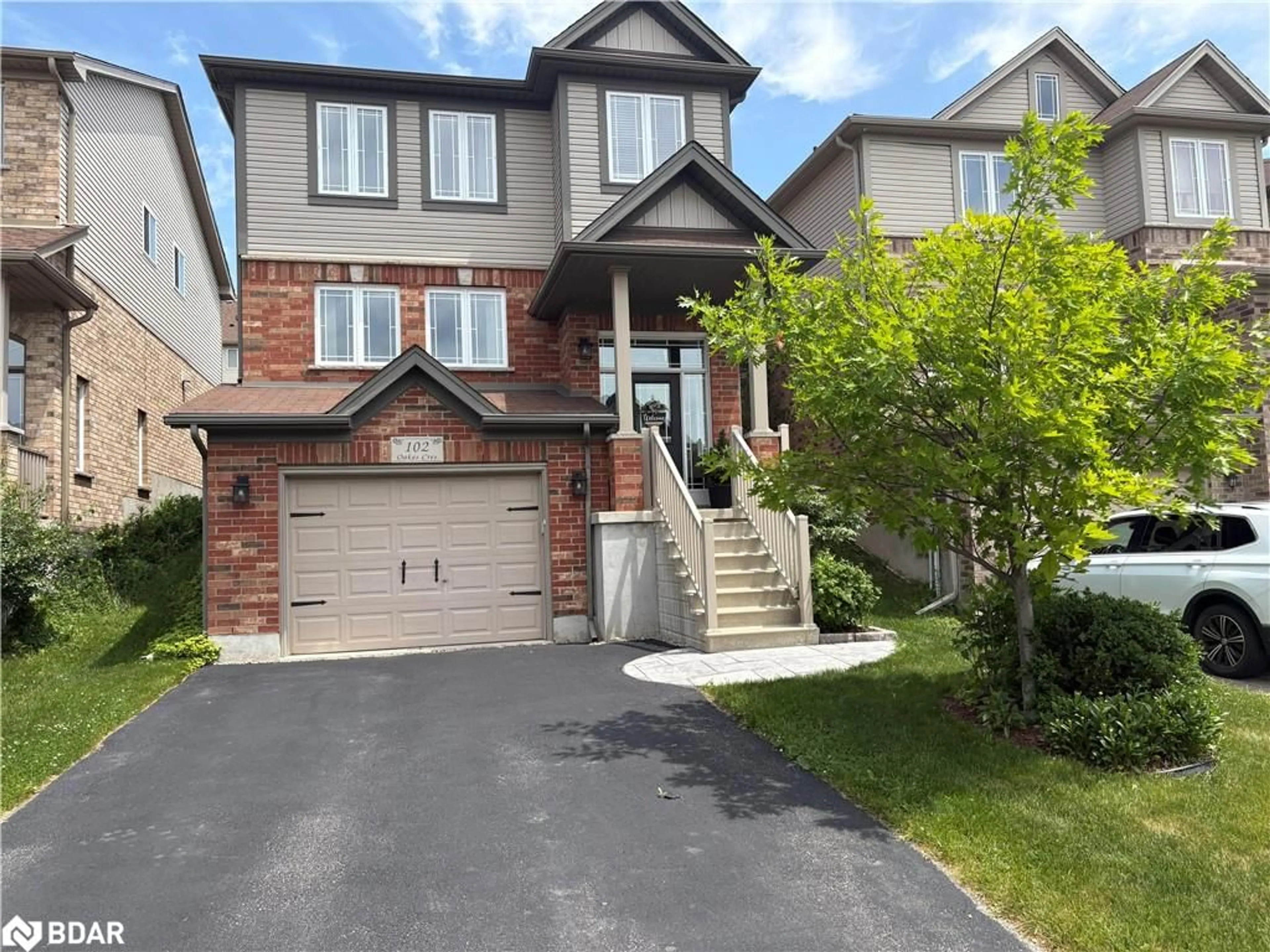 Home with brick exterior material, street for 102 Oakes Crescent Cres, Guelph Ontario N1E 0J5