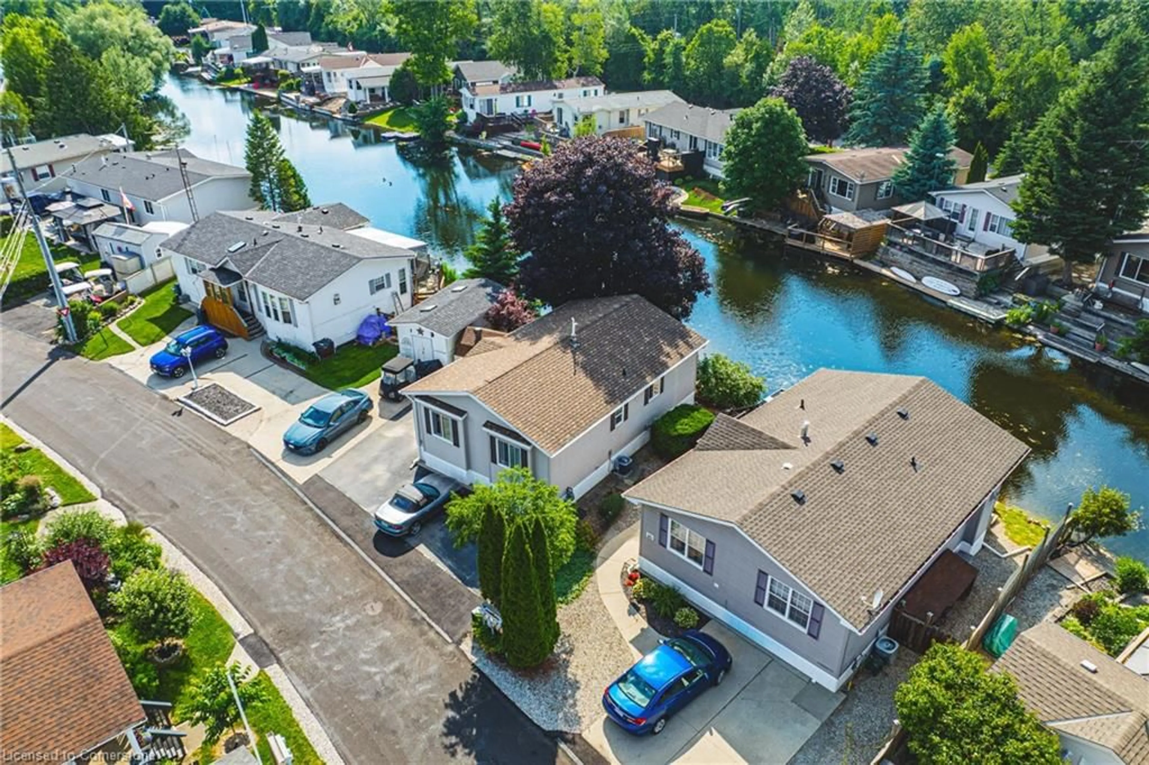 A pic from outside/outdoor area/front of a property/back of a property/a pic from drone, water/lake/river/ocean view for 52 Hemlock Crs Pvt, Puslinch Ontario N0B 2J0