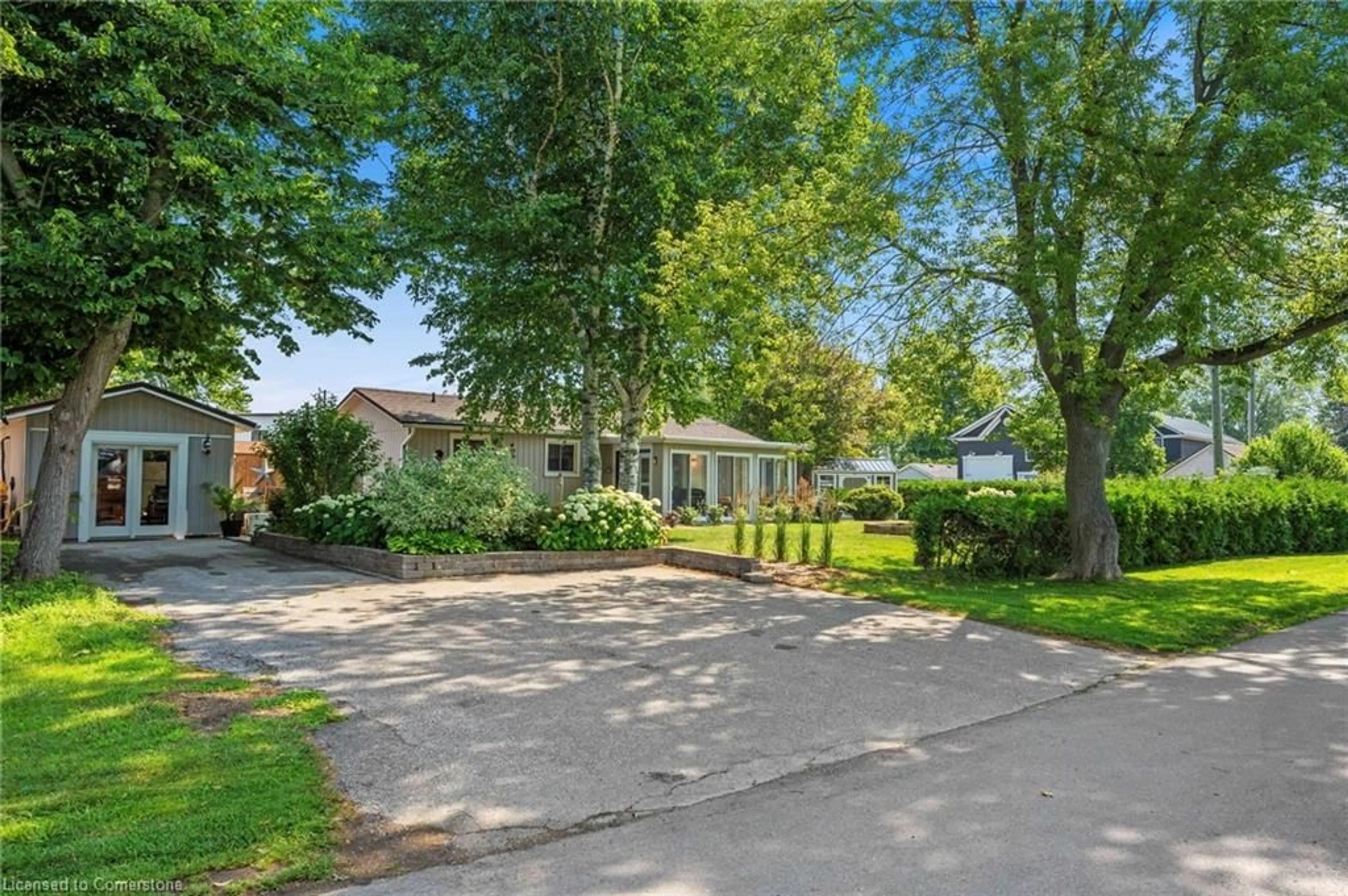 A pic from outside/outdoor area/front of a property/back of a property/a pic from drone, street for 181 Cedar Dr Dr, Turkey Point Ontario N0E 1T0