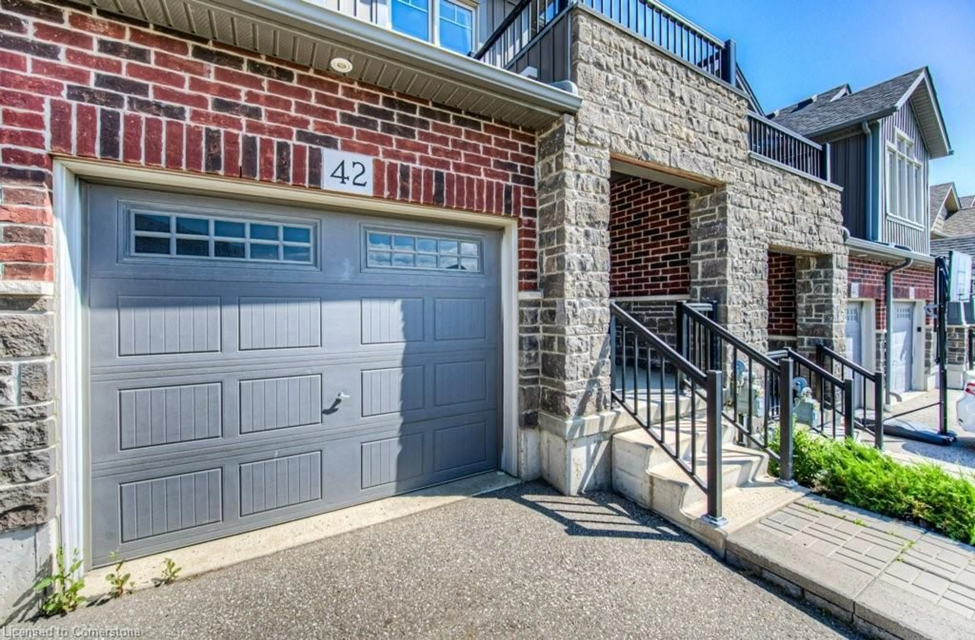 Home with brick exterior material, street for 42 Eliza Ave, Kitchener Ontario N2E 0B9