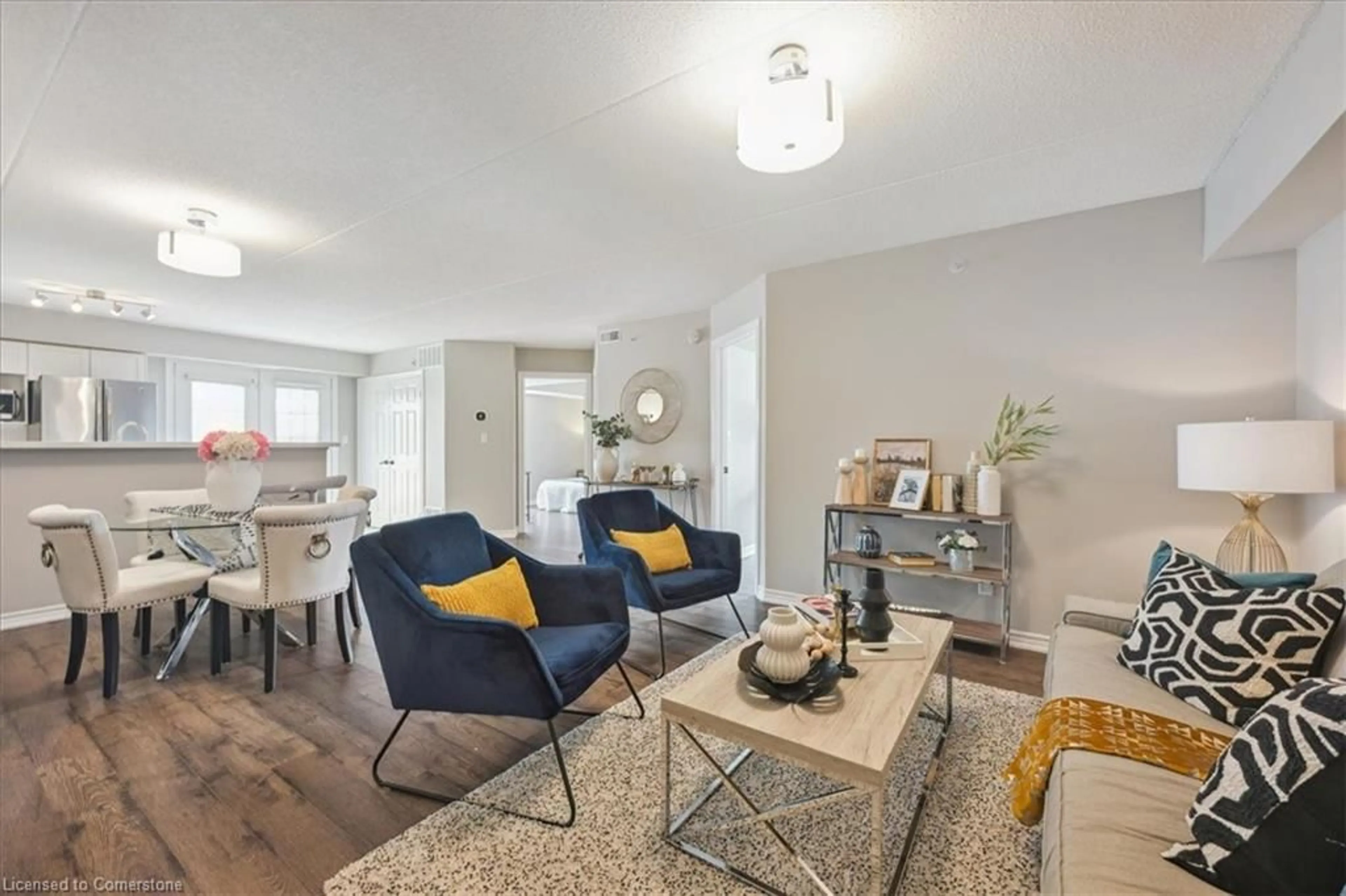Living room with furniture, wood/laminate floor for 1460 Bishops Gate #201, Oakville Ontario L6M 4N5