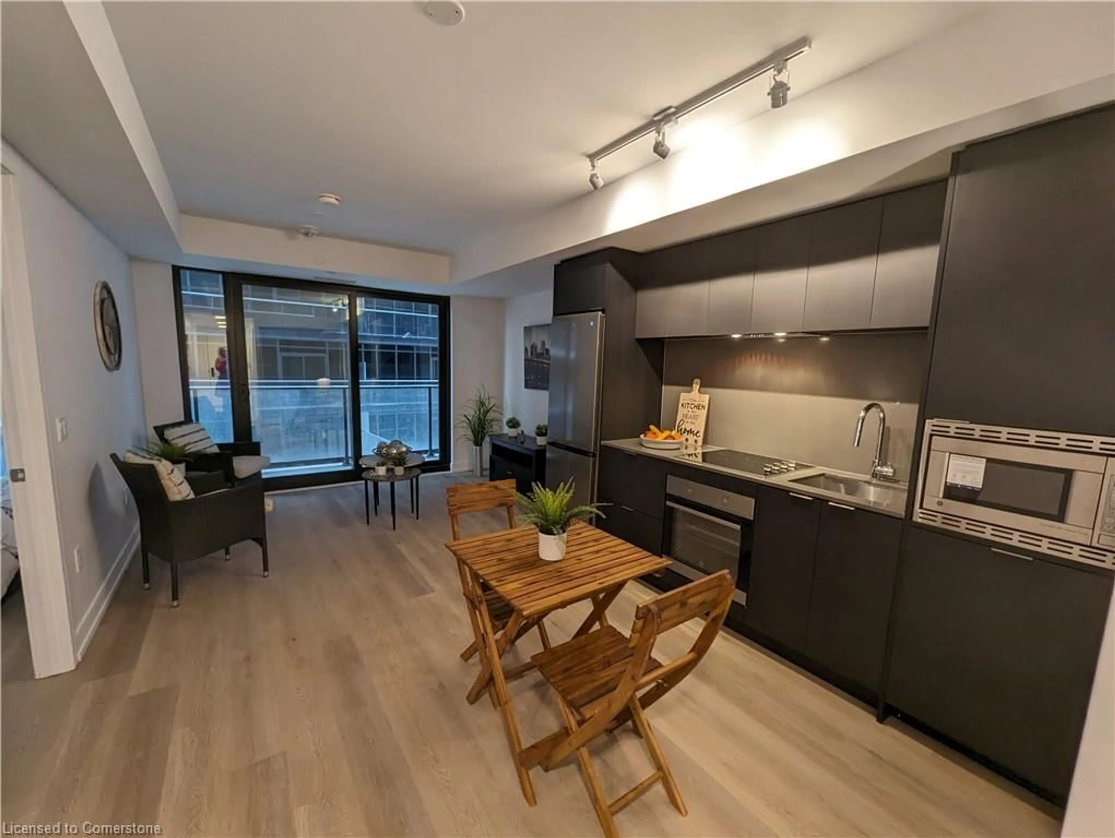 Open concept kitchen, wood/laminate floor for 1 Jarvis St #518, Hamilton Ontario L8R 3J2