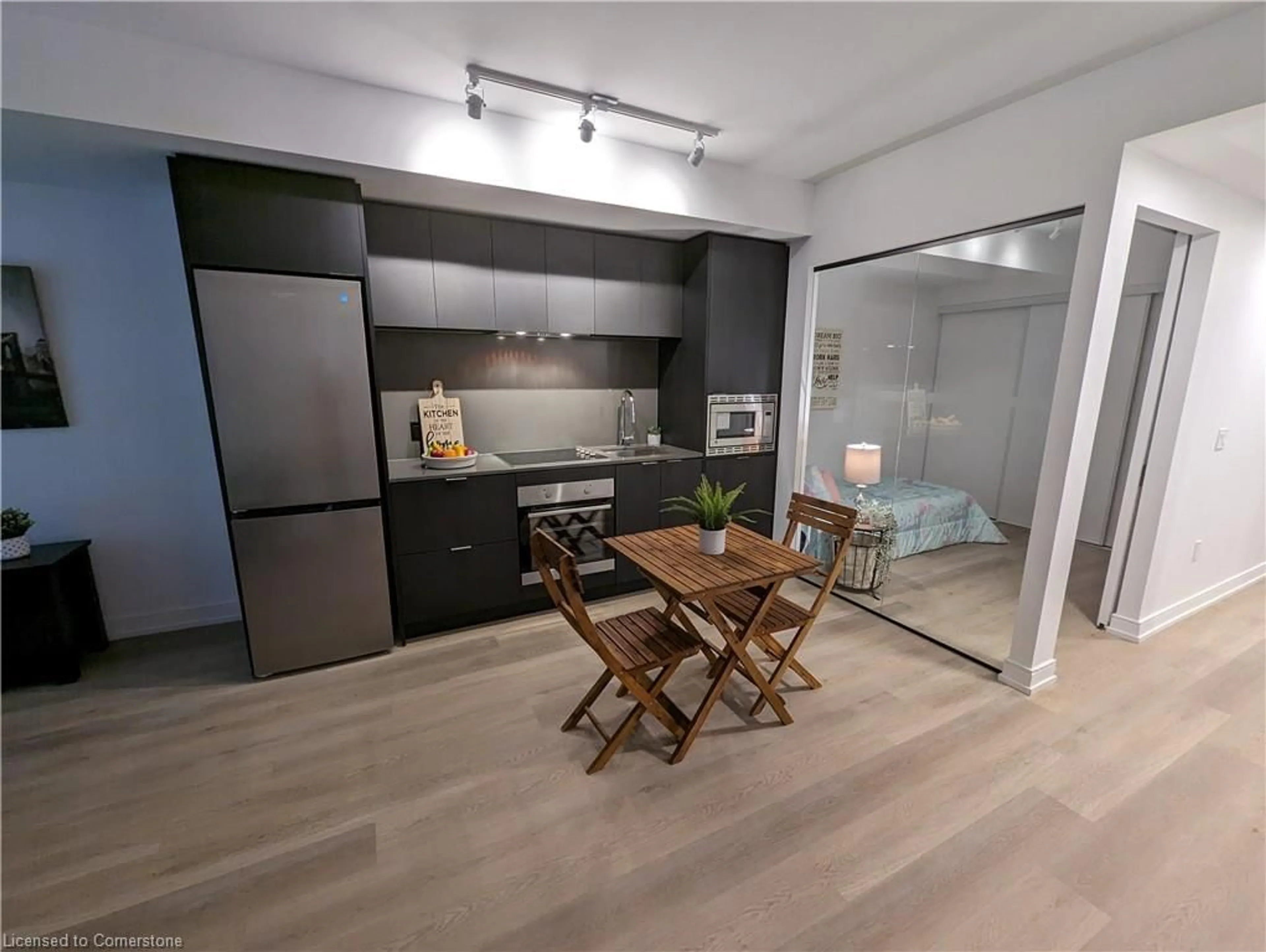 Open concept kitchen, wood/laminate floor for 1 Jarvis St #518, Hamilton Ontario L8R 3J2