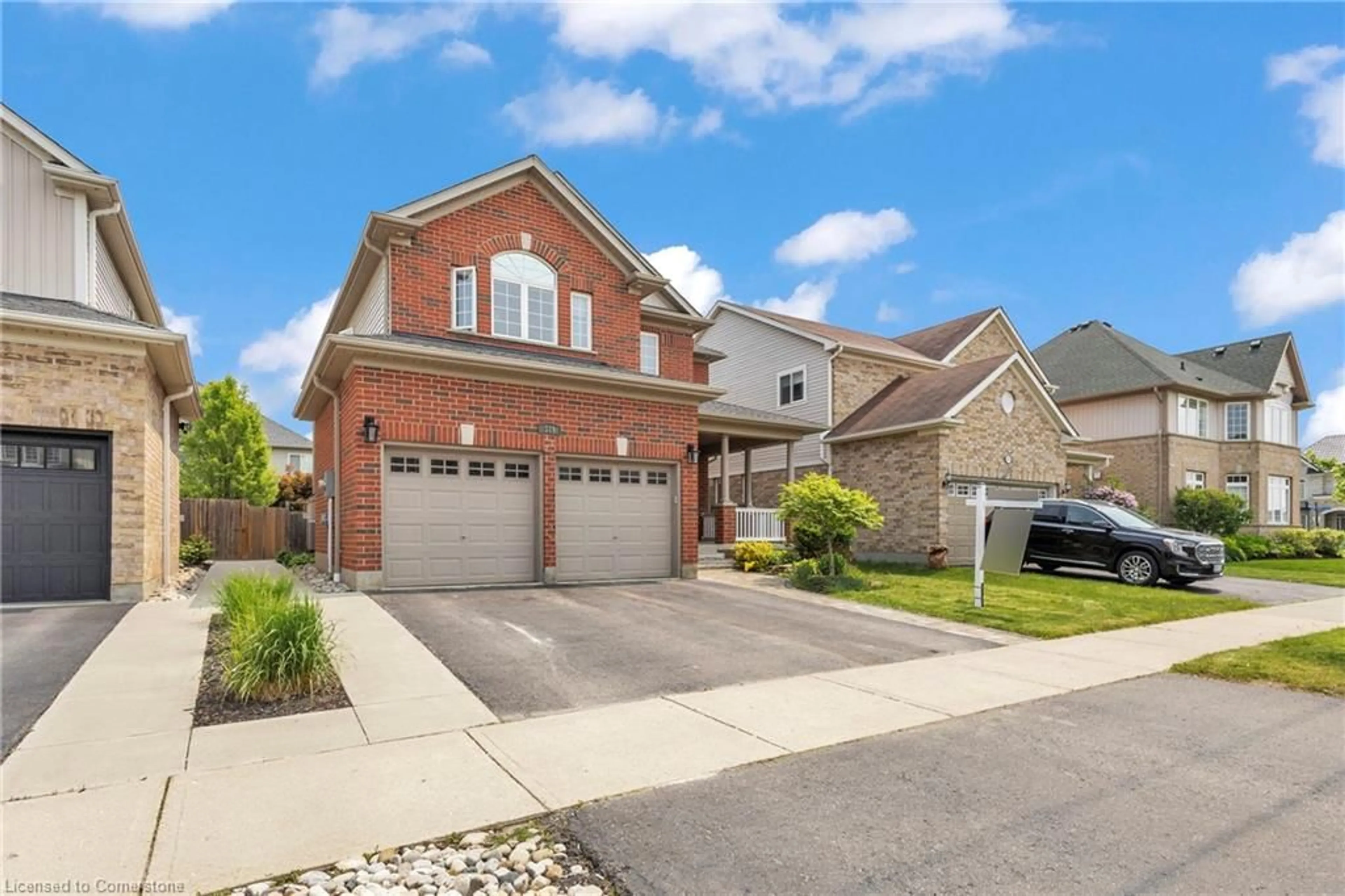 Home with brick exterior material, street for 319 Robert Ferrie Dr, Kitchener Ontario N2P 2Y7
