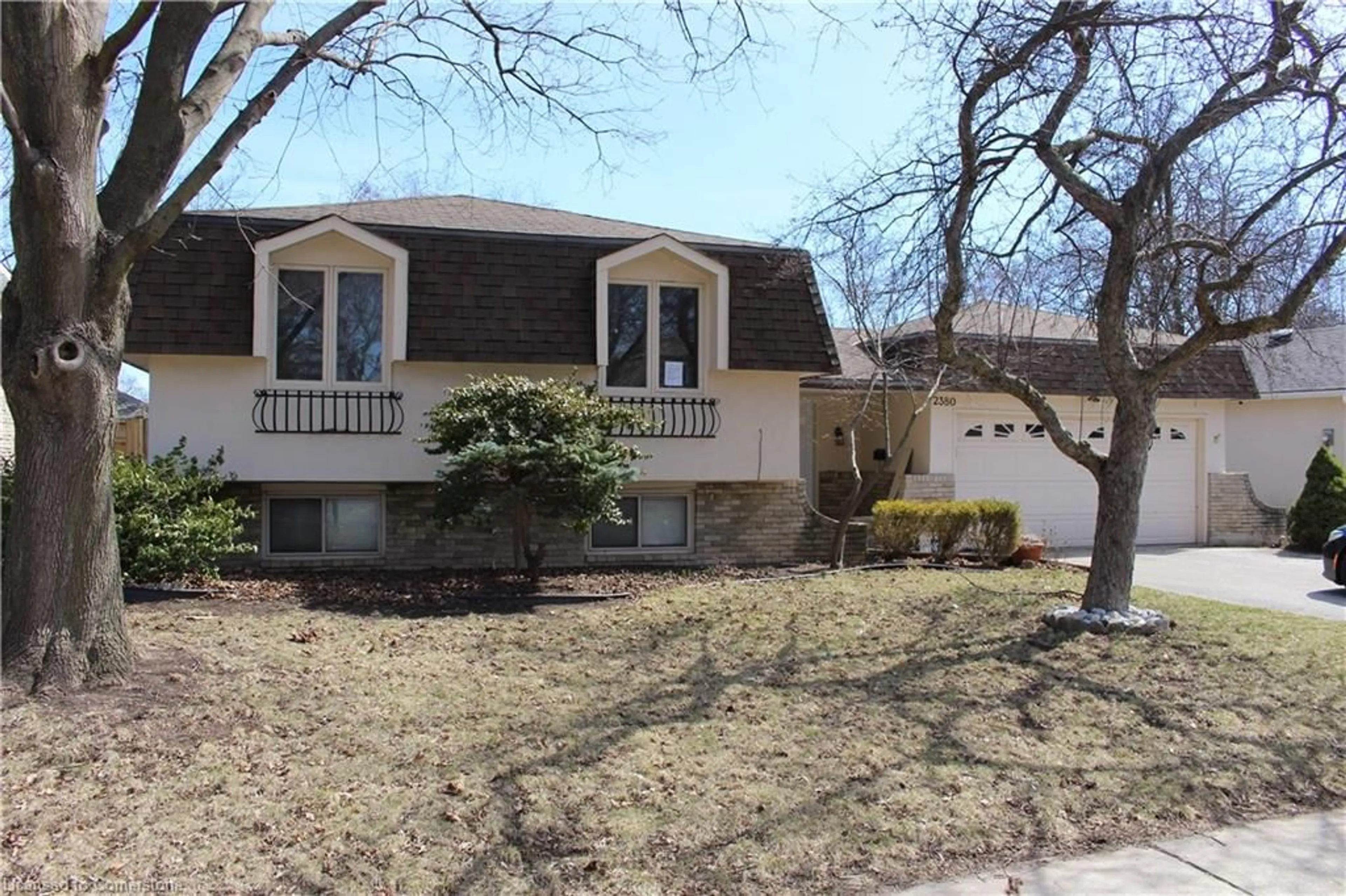 Home with vinyl exterior material, street for 2380 Bridge Rd, Oakville Ontario L6L 2G6