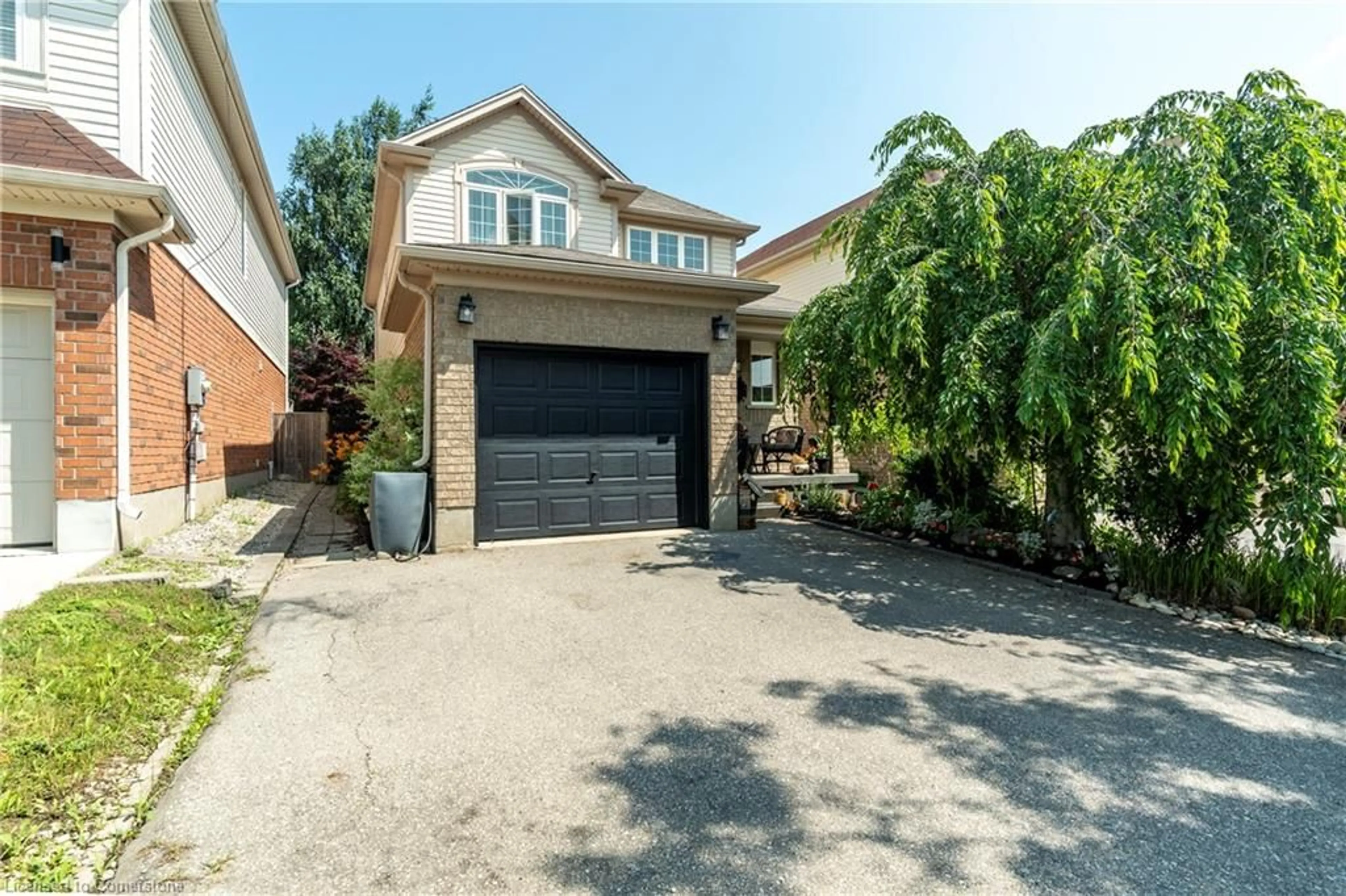 Home with brick exterior material, street for 584 Commonwealth Cres, Kitchener Ontario N2E 4K1
