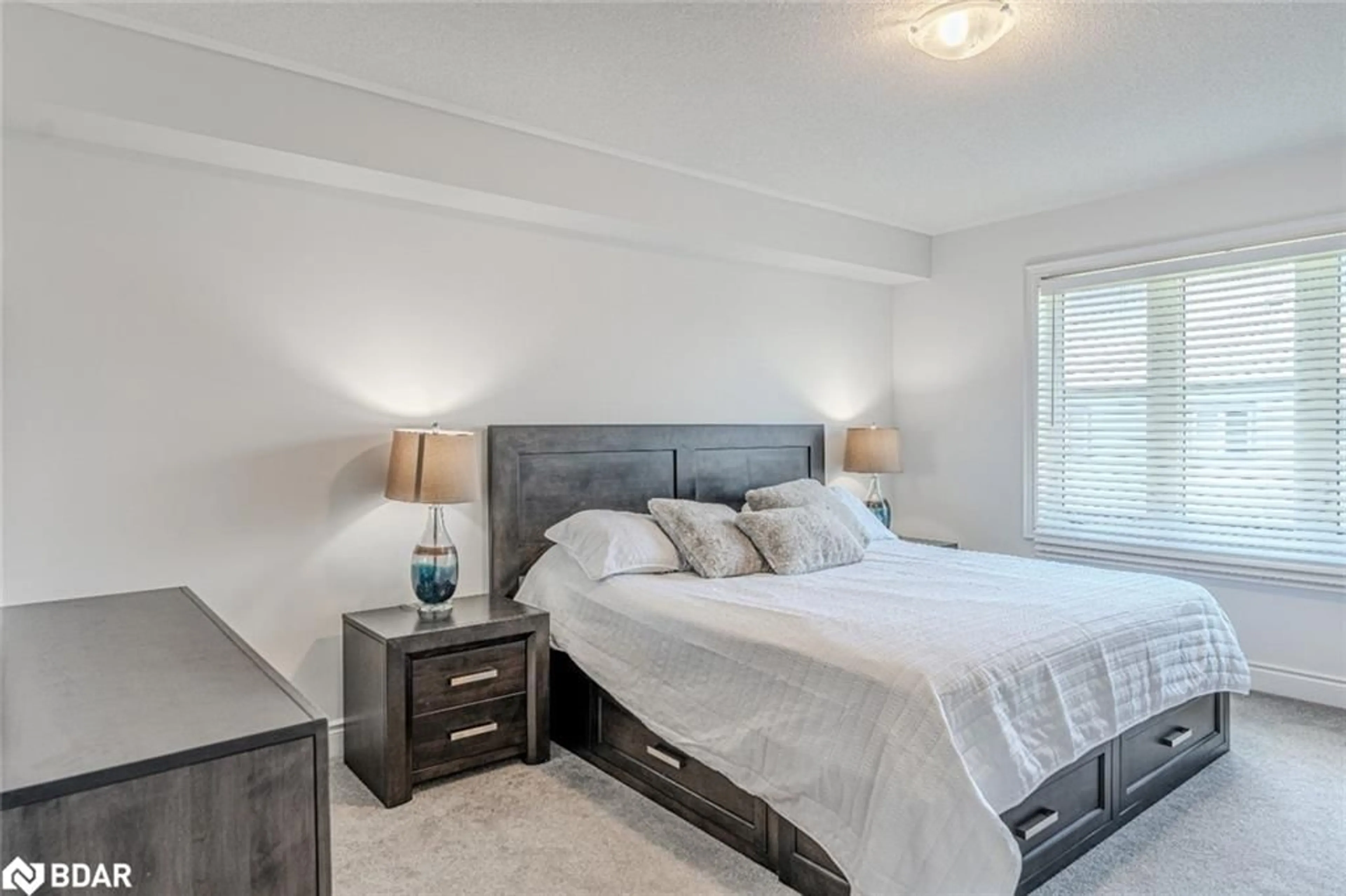 Bedroom with bed, wood/laminate floor for 20 Lisa Street, Wasaga Beach Ontario L9Z 0K8