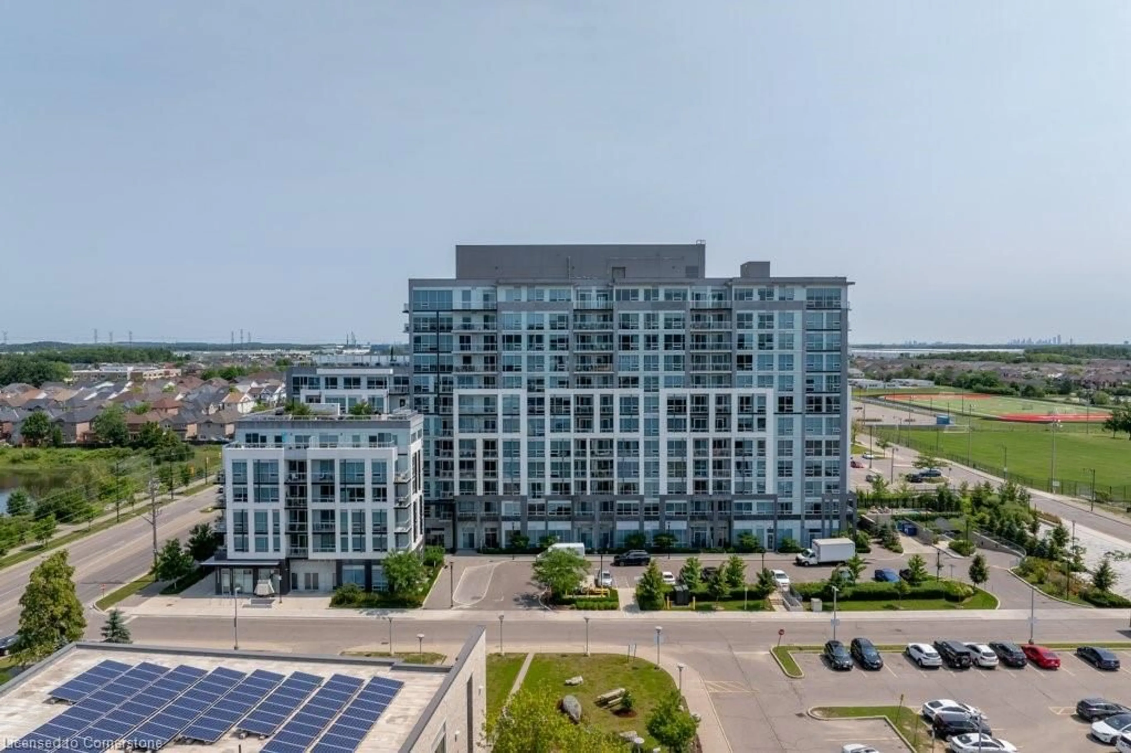 A pic from outside/outdoor area/front of a property/back of a property/a pic from drone, building for 1050 Main St #1004, Milton Ontario L9T 9M3