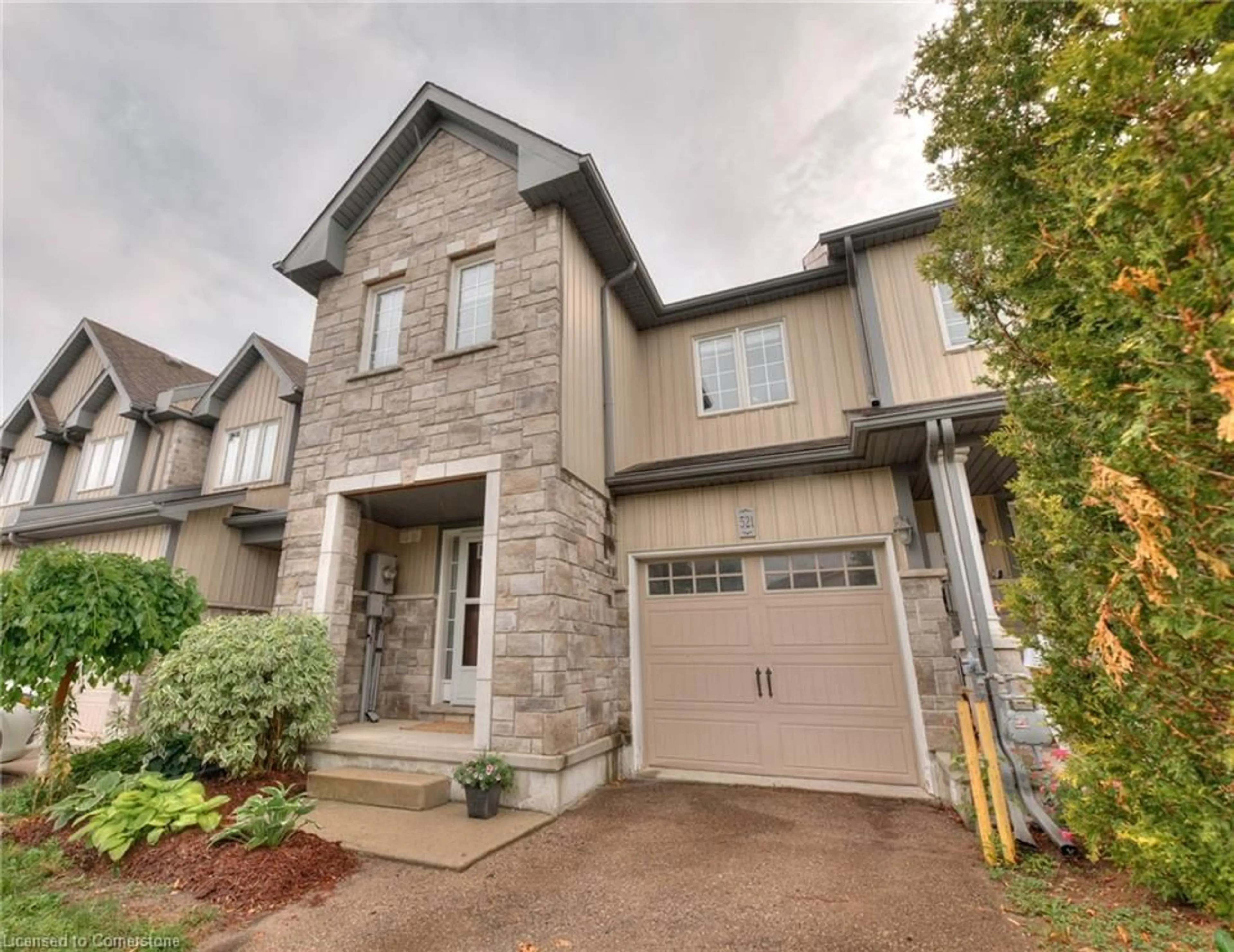 Home with brick exterior material, street for 521 Windflower Cres, Kitchener Ontario N2E 3T2