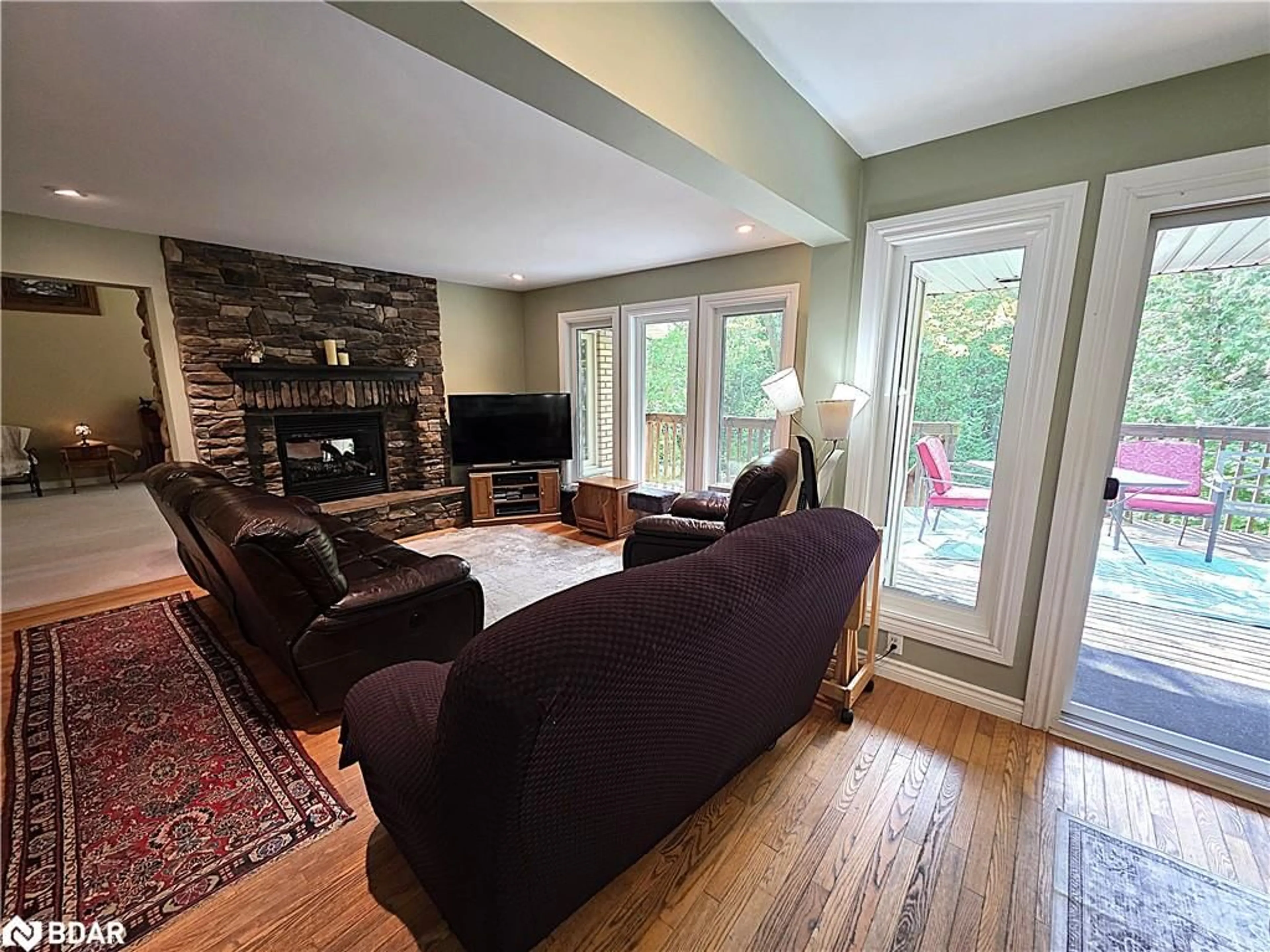 Living room with furniture, wood/laminate floor for 7190 93 Hwy, Tiny Ontario L0K 2E1
