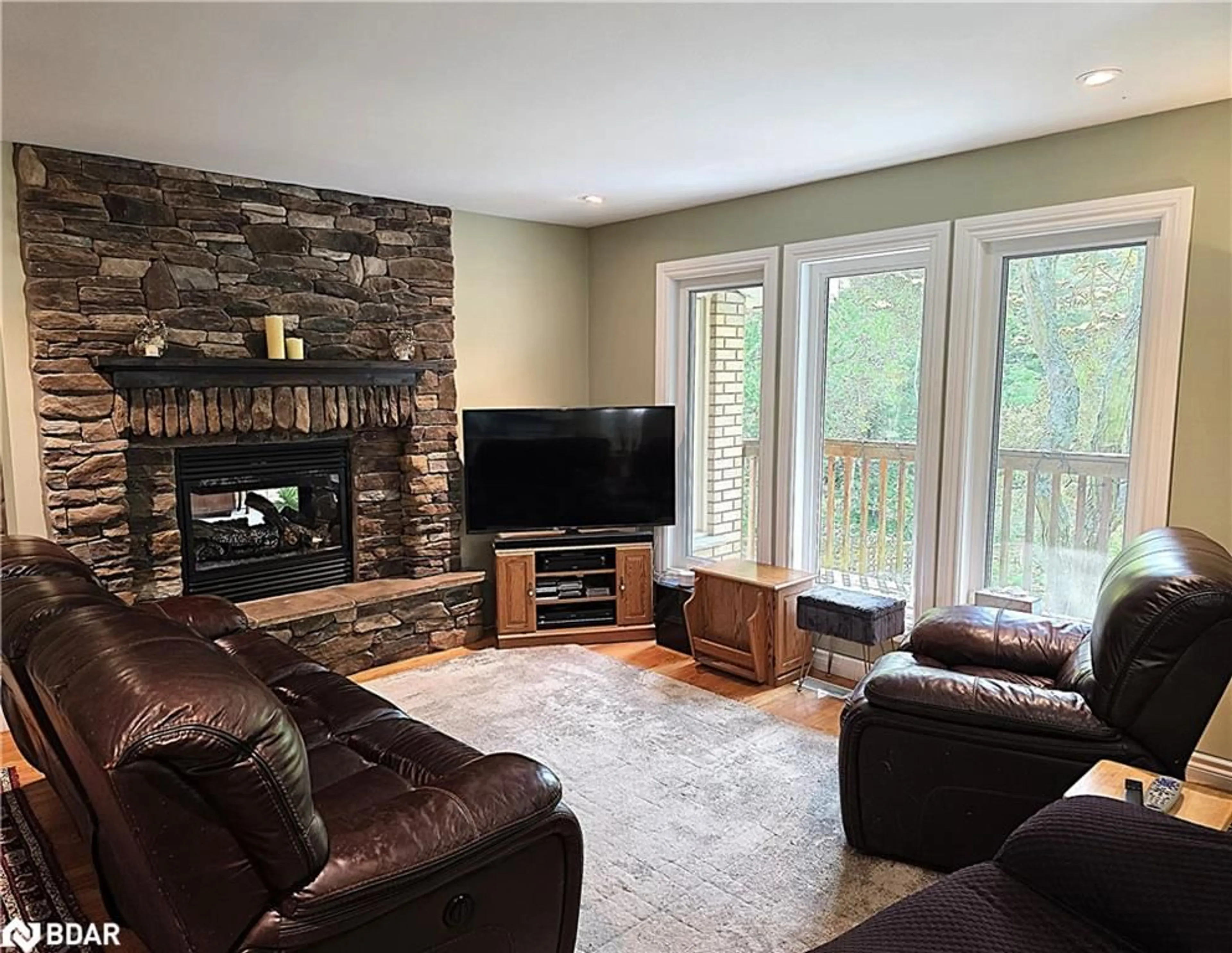 Living room with furniture, wood/laminate floor for 7190 93 Hwy, Tiny Ontario L0K 2E1