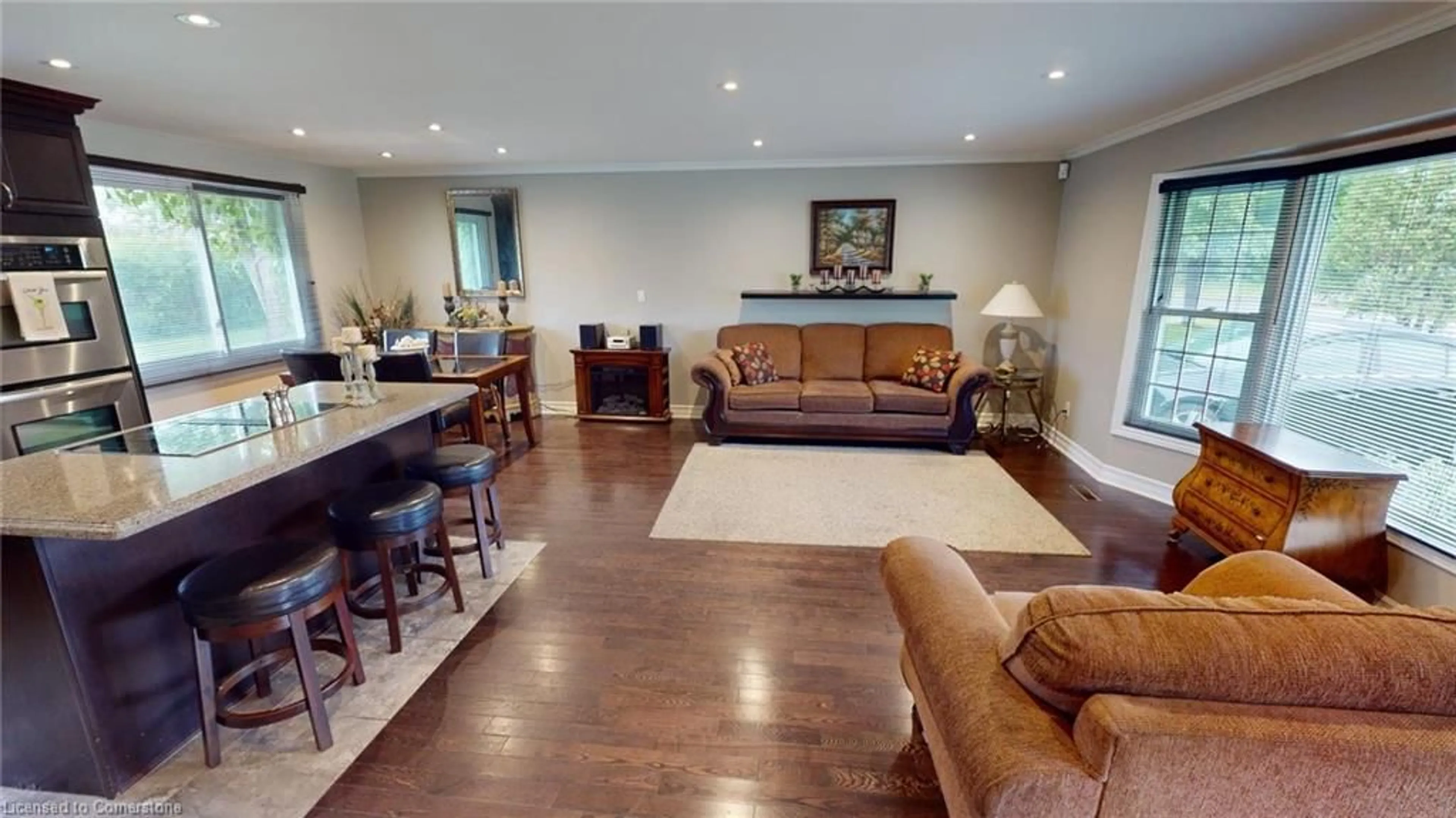 Living room with furniture, wood/laminate floor for 978 Ferndale Ave, Fort Erie Ontario L2A 5S8