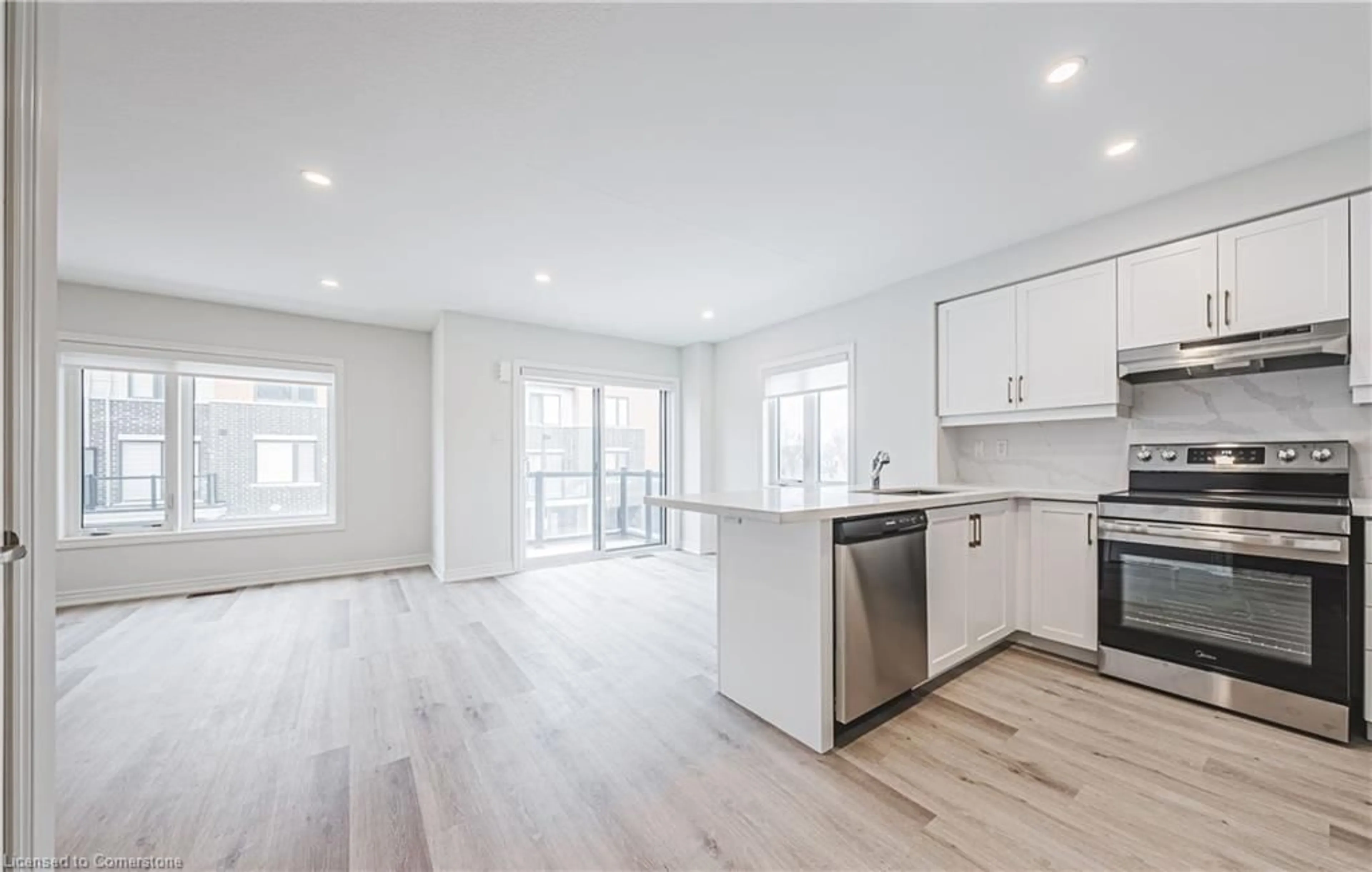 Open concept kitchen, wood/laminate floor for 55 Dryden Lane Lane, Hamilton Ontario L8H 1L9