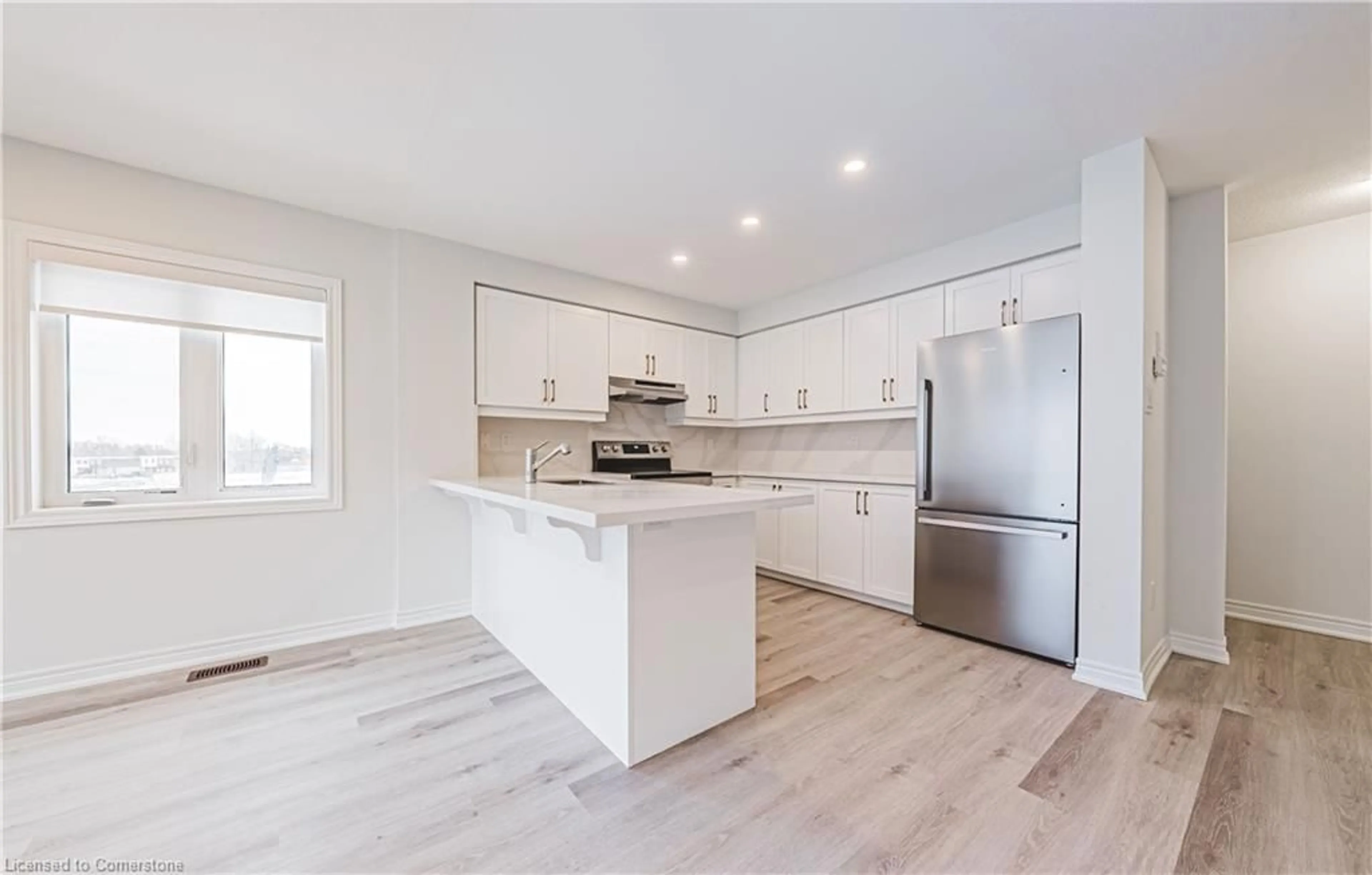 Open concept kitchen, wood/laminate floor for 55 Dryden Lane Lane, Hamilton Ontario L8H 1L9
