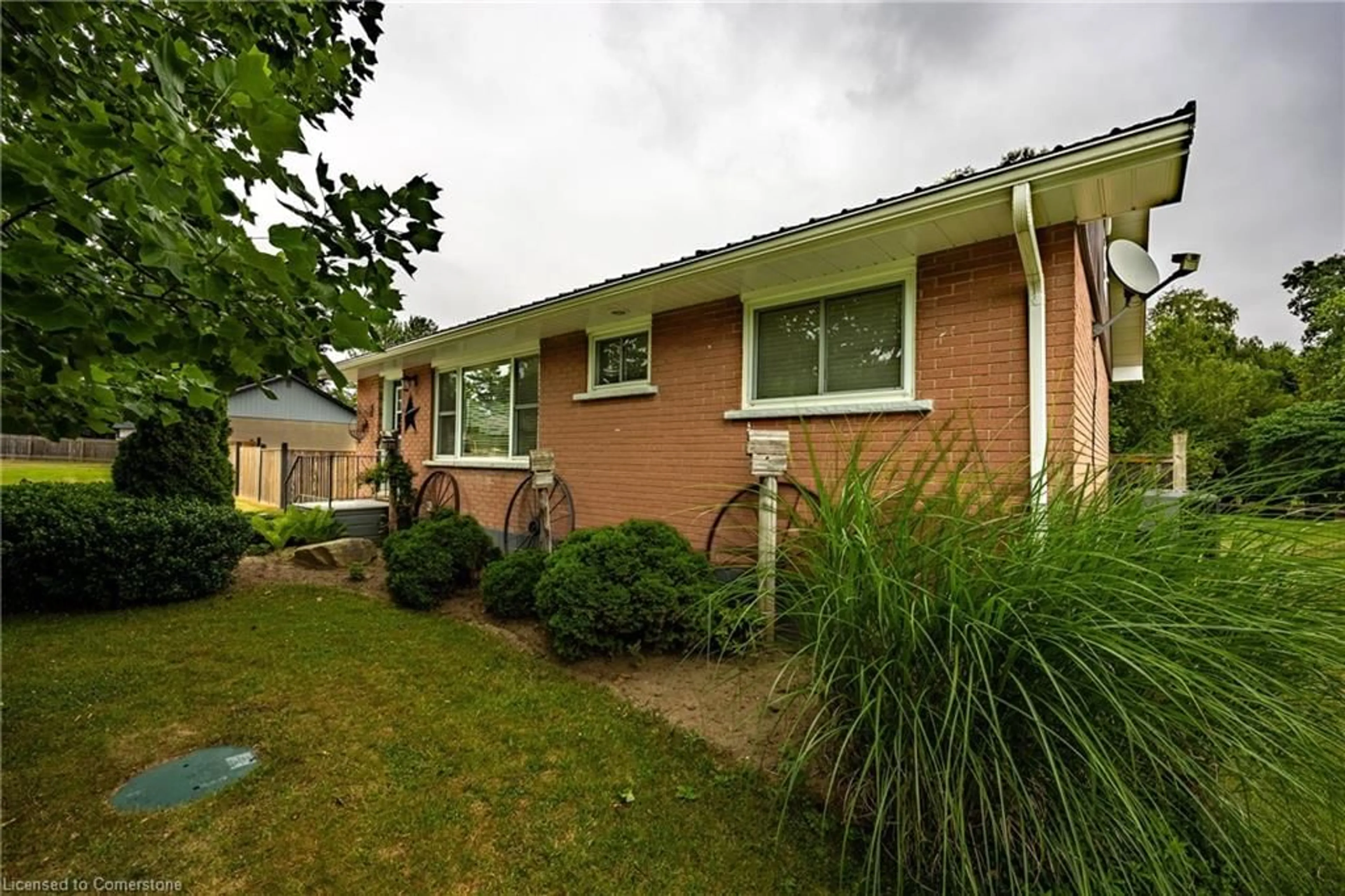 Home with brick exterior material, street for 24 Henry St, Delhi Ontario N4B 2G1
