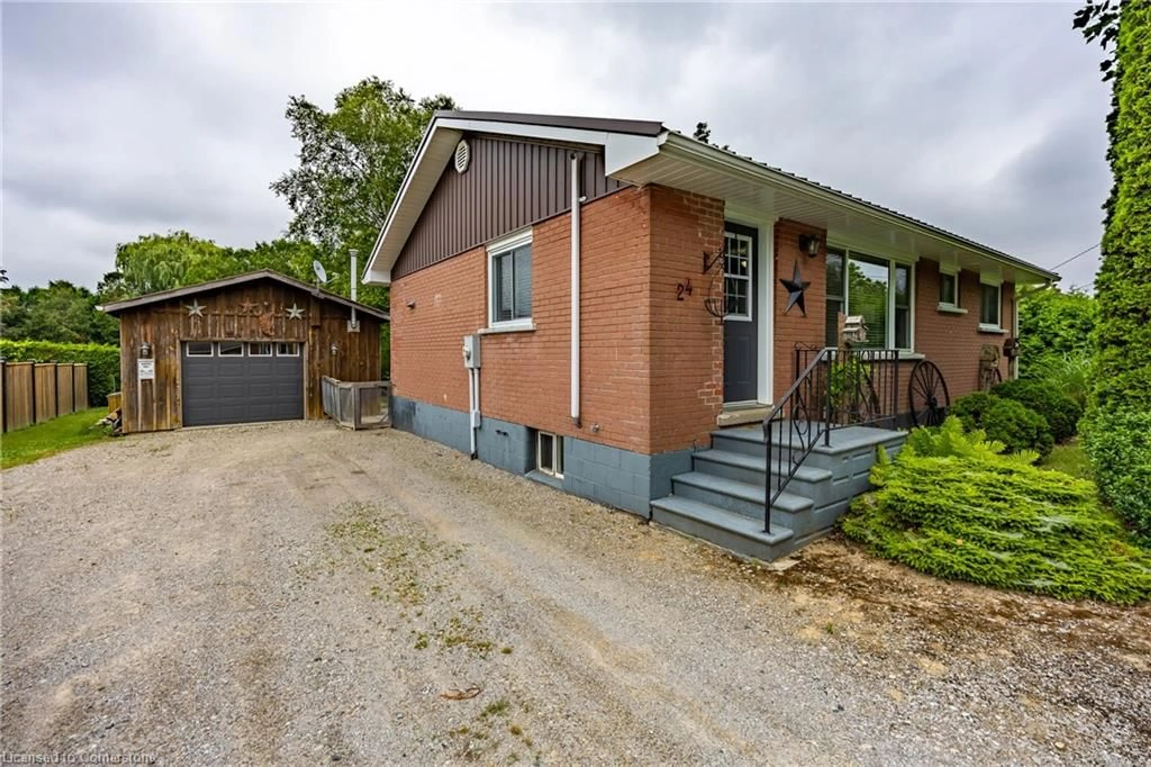 Home with brick exterior material, street for 24 Henry St, Delhi Ontario N4B 2G1
