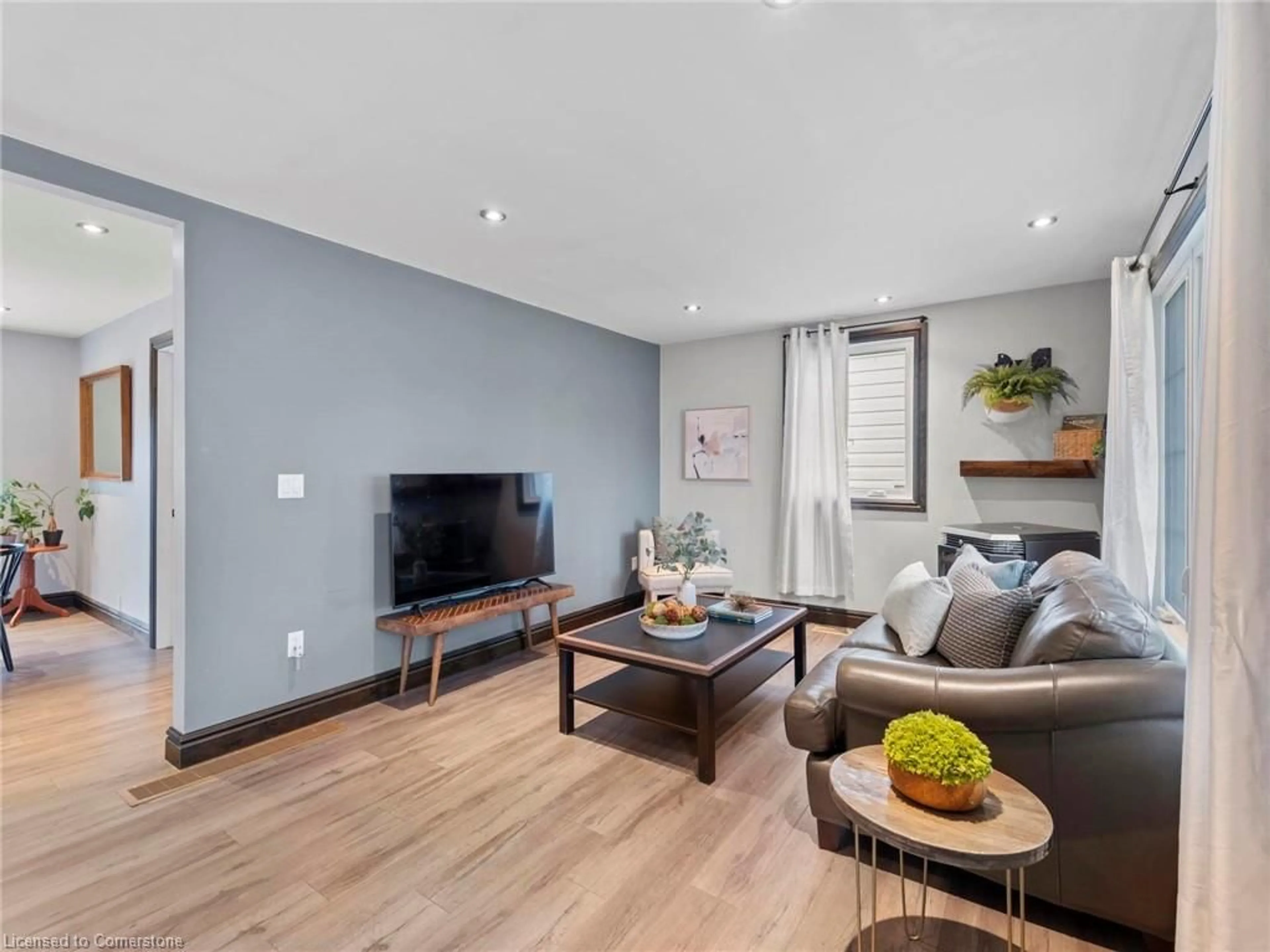 Living room with furniture, wood/laminate floor for 6992 Raglan St, Dublin Ontario N0K 1E0