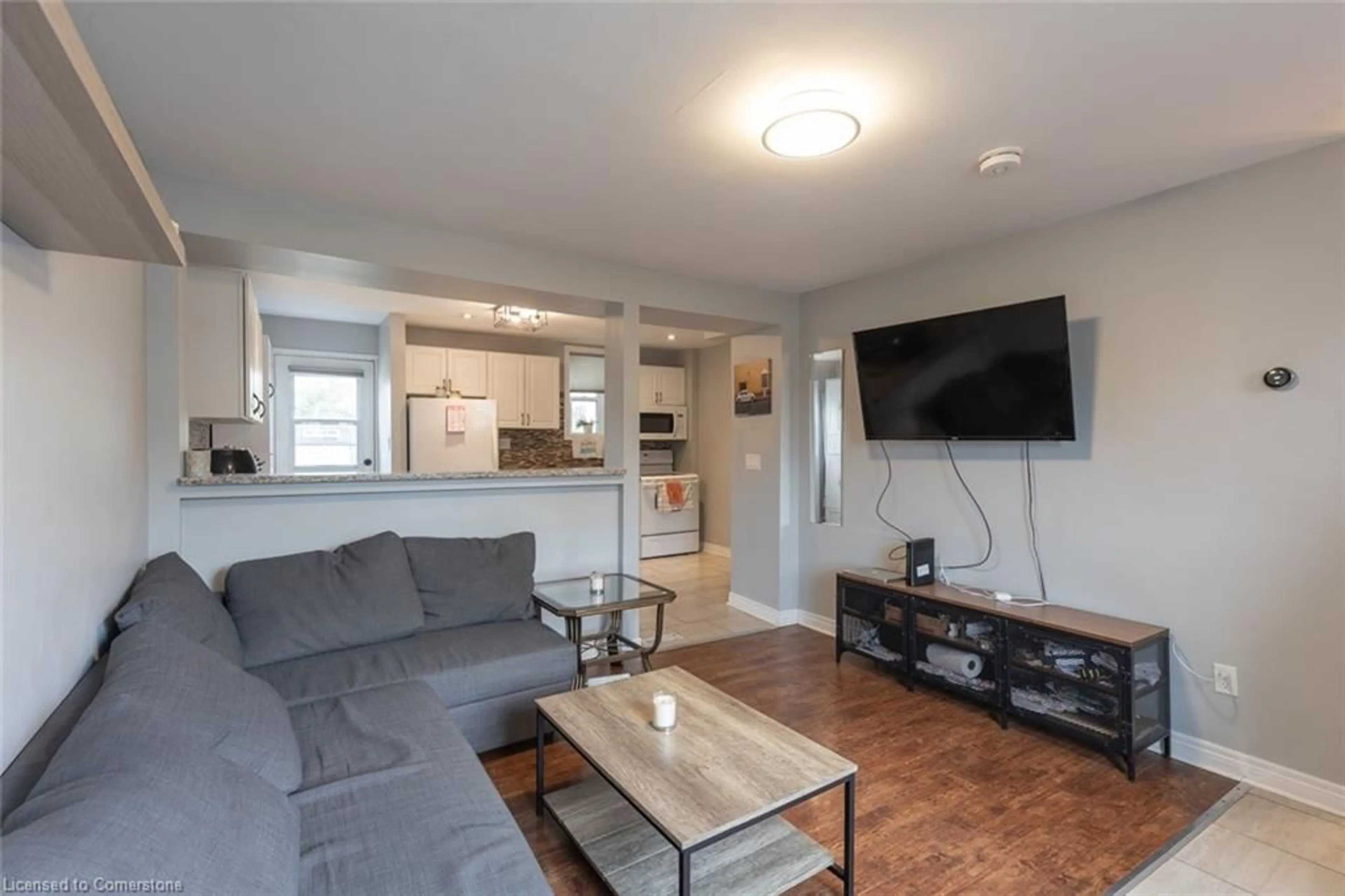 Living room with furniture, wood/laminate floor for 174 Grace Ave, Hamilton Ontario L8H 3X2