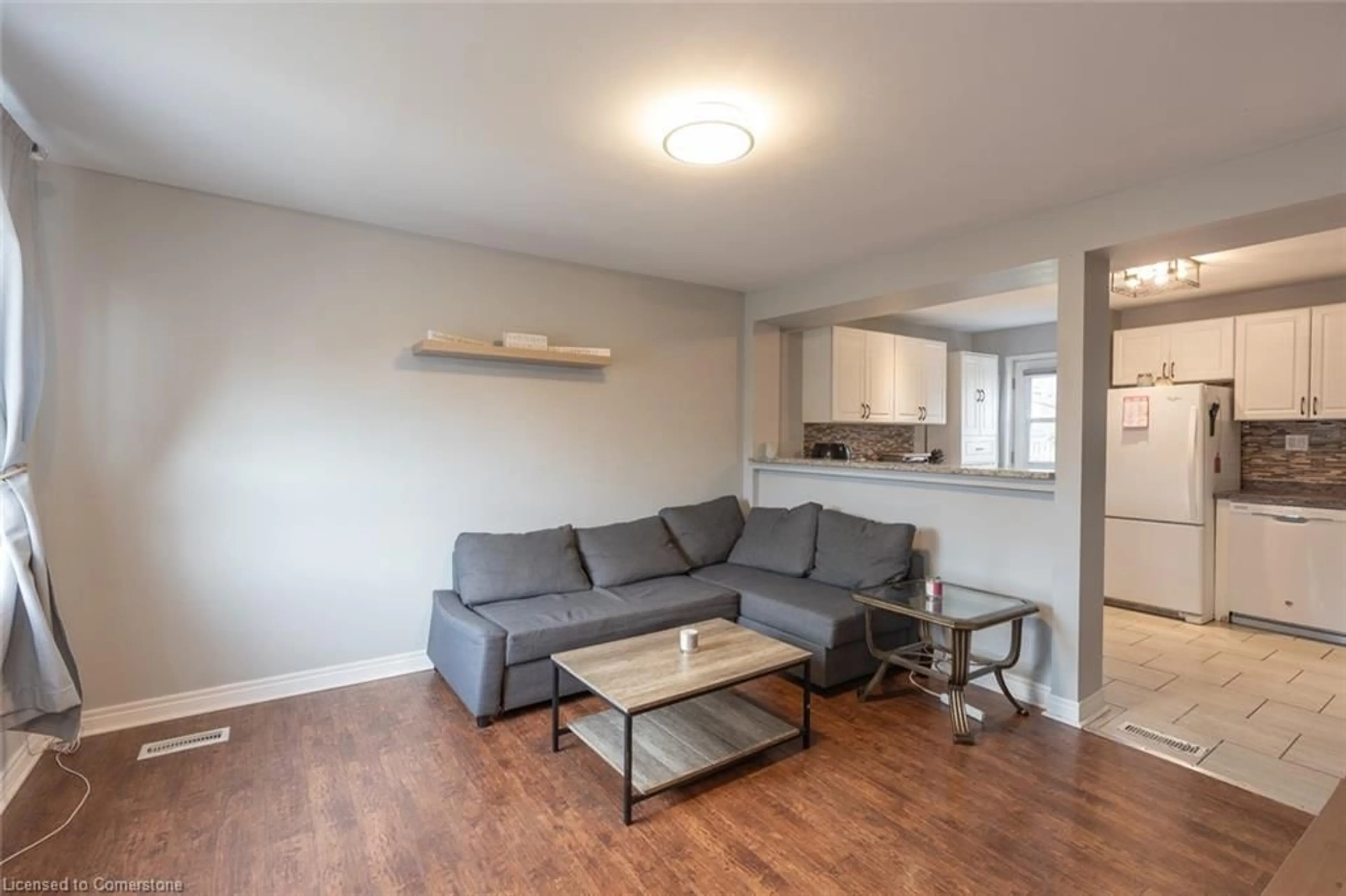 Living room with furniture, wood/laminate floor for 174 Grace Ave, Hamilton Ontario L8H 3X2