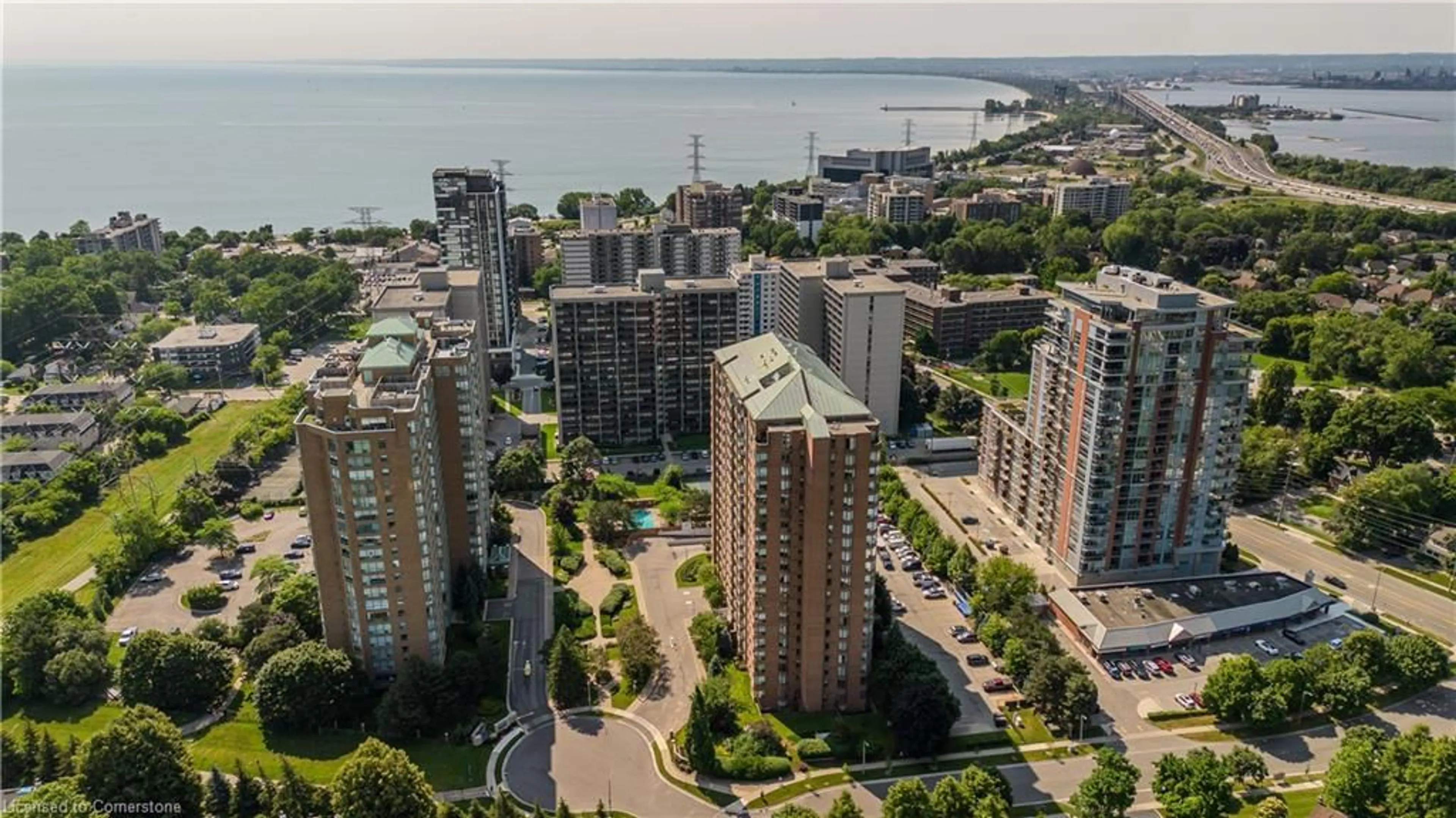 A pic from outside/outdoor area/front of a property/back of a property/a pic from drone, city buildings view from balcony for 1276 Maple Crossing Blvd #212, Burlington Ontario L7S 2J9