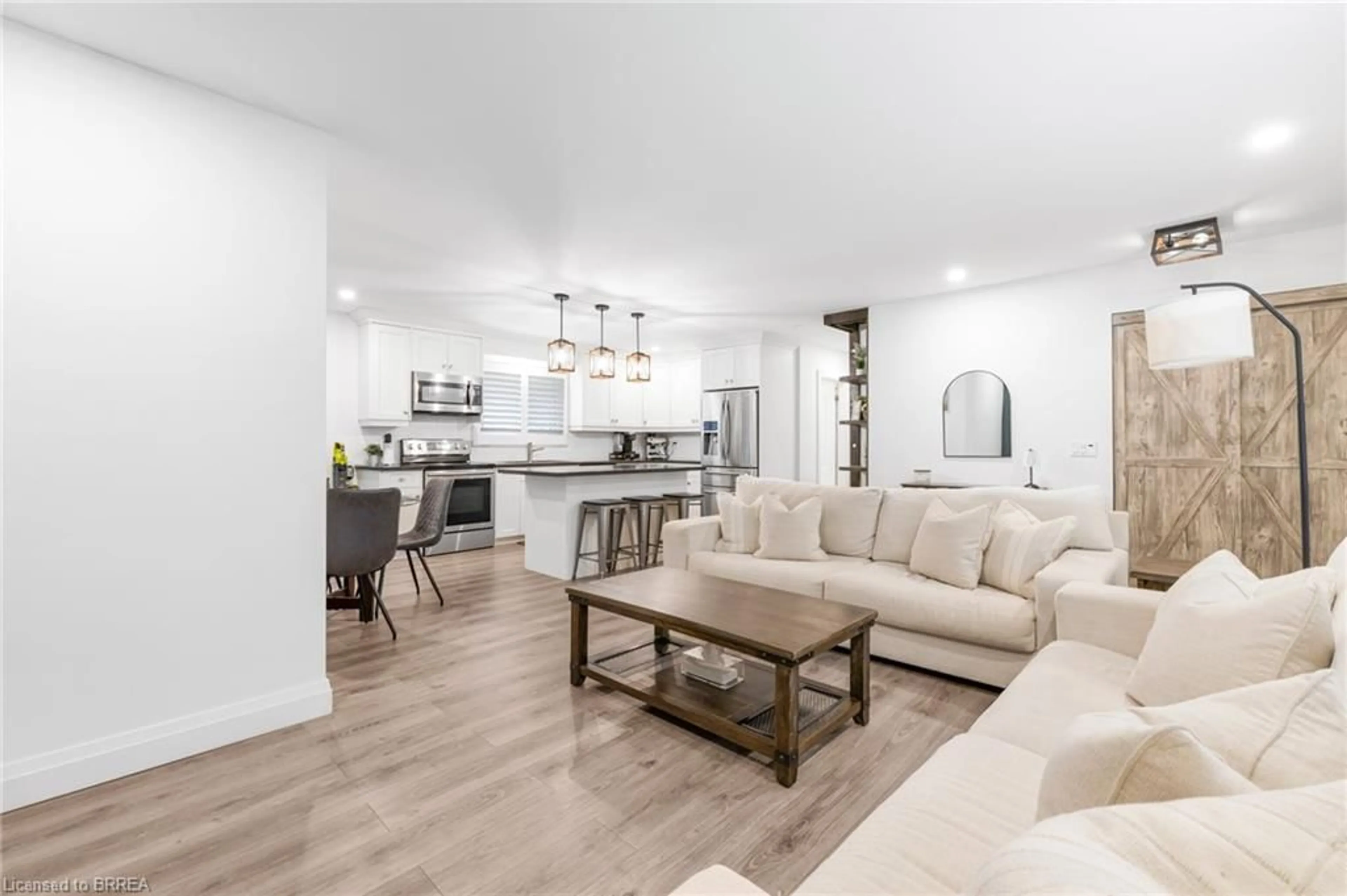 Open concept kitchen, wood/laminate floor for 403 Oakhill Dr, Brantford Ontario N3T 5L7