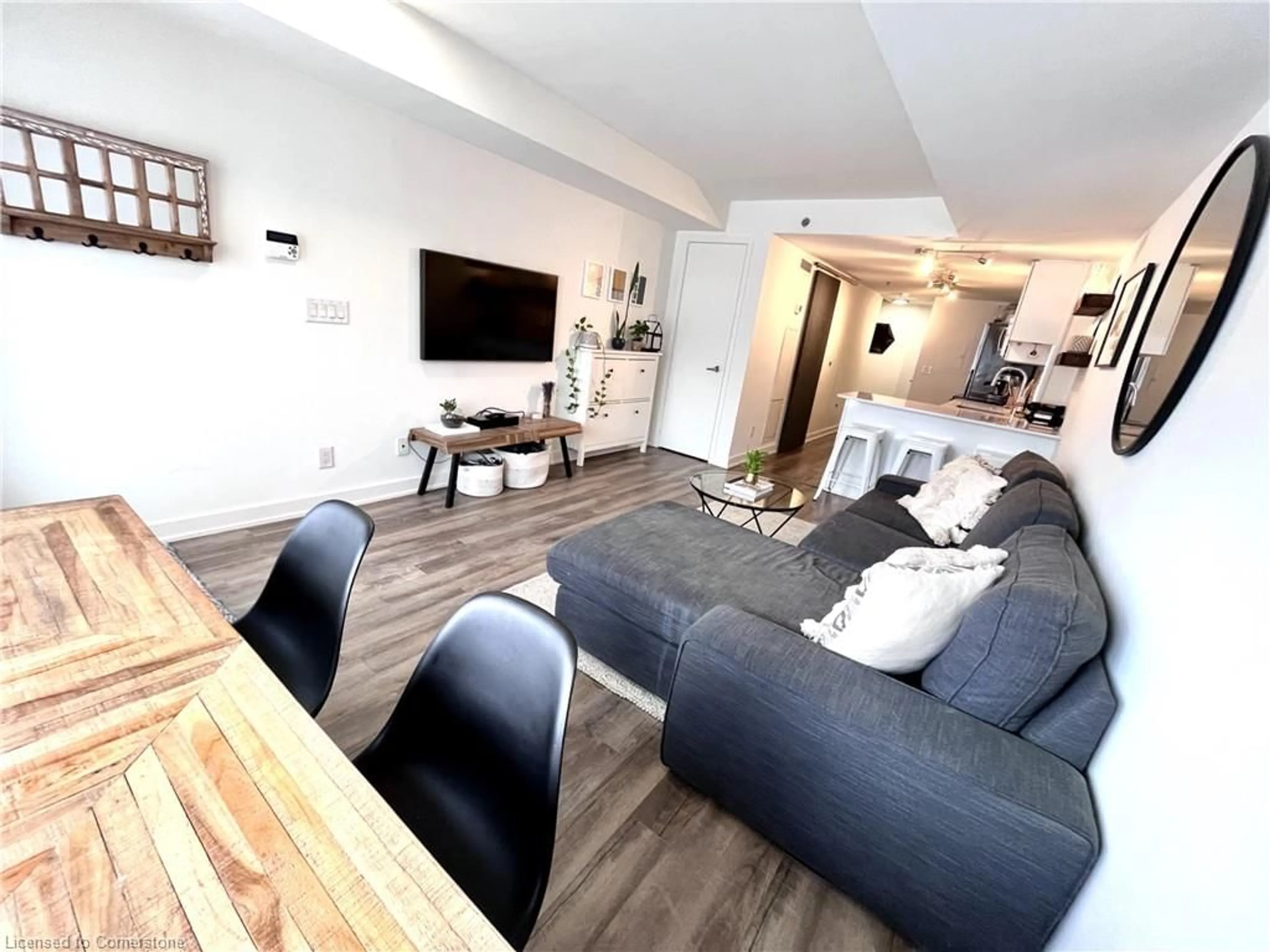 Living room with furniture, wood/laminate floor for 11 Superior Ave #TH1, Toronto Ontario M8V 0A7