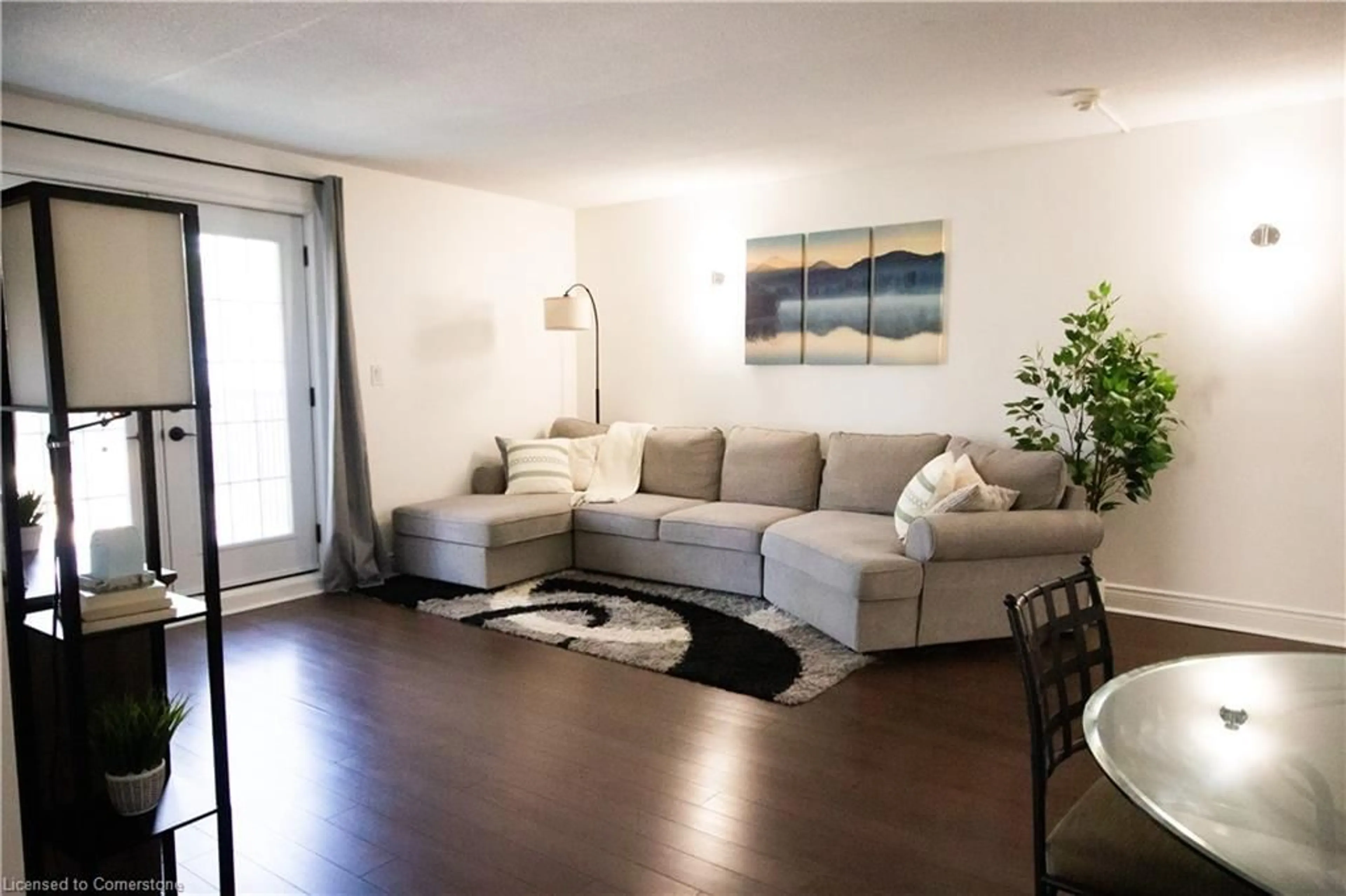 Living room with furniture, wood/laminate floor for 2040 Cleaver Ave #214, Burlington Ontario L7M 4C4