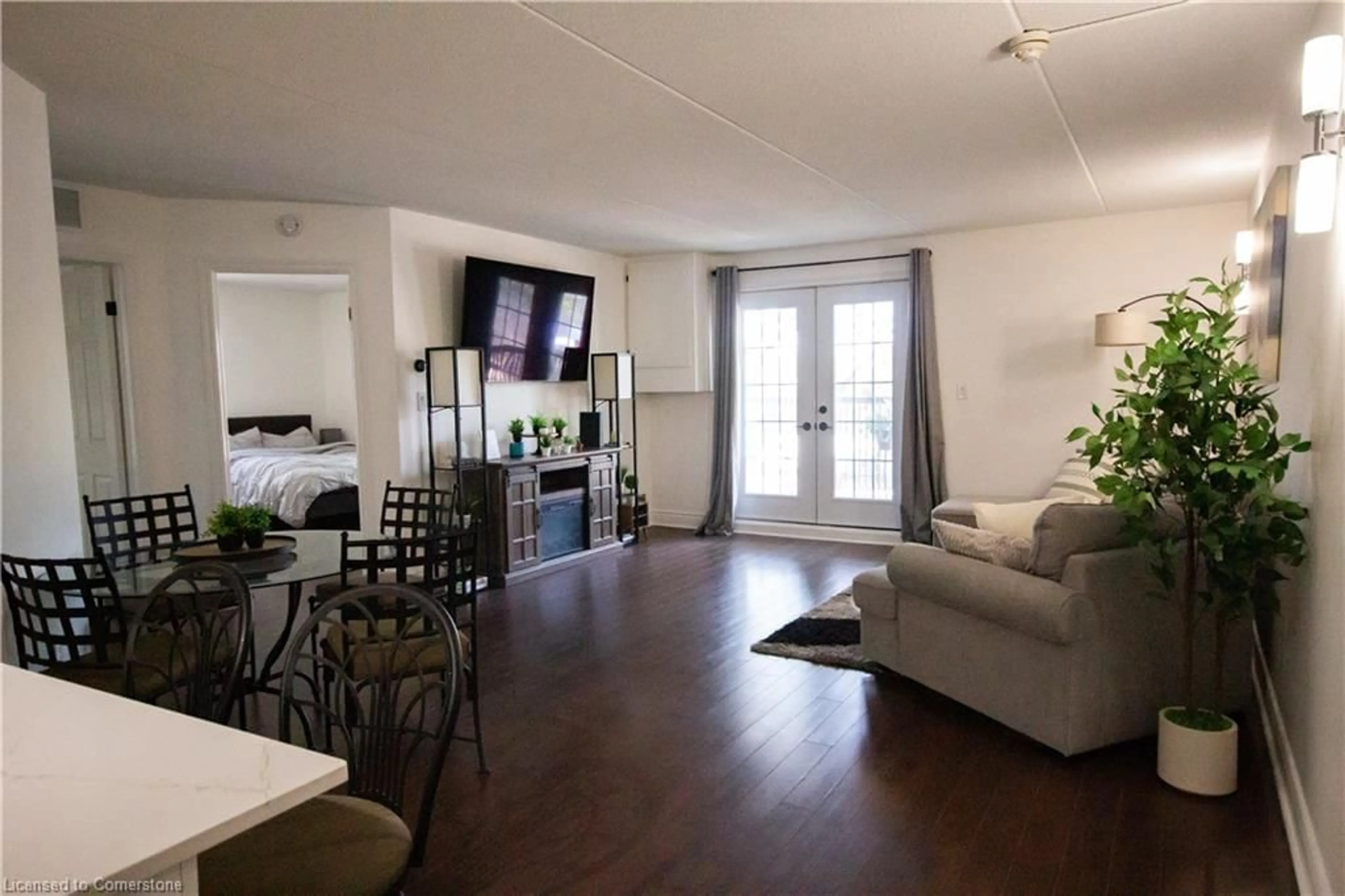 Living room with furniture, wood/laminate floor for 2040 Cleaver Ave #214, Burlington Ontario L7M 4C4