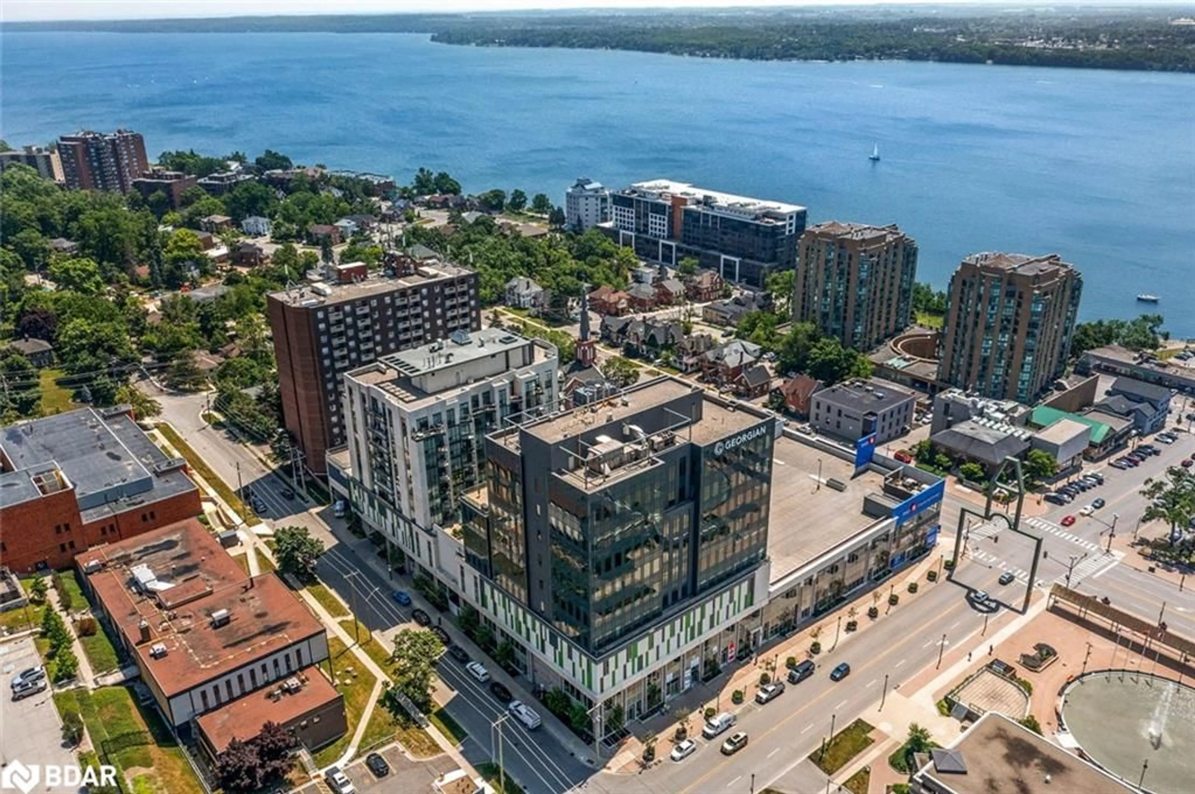 A pic from outside/outdoor area/front of a property/back of a property/a pic from drone, building for 111 Worsley Street #302, Barrie Ontario L4M 0J5