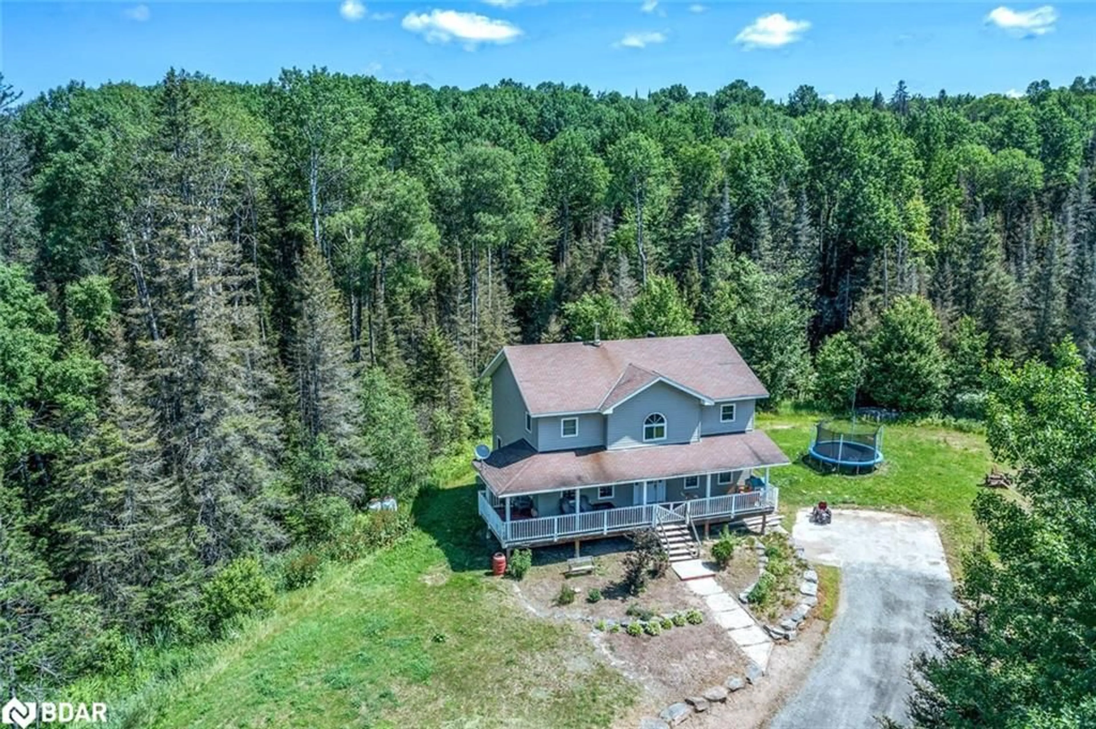 A pic from outside/outdoor area/front of a property/back of a property/a pic from drone, unknown for 215 O'brien Rd, Sundridge Ontario P0A 1Z0