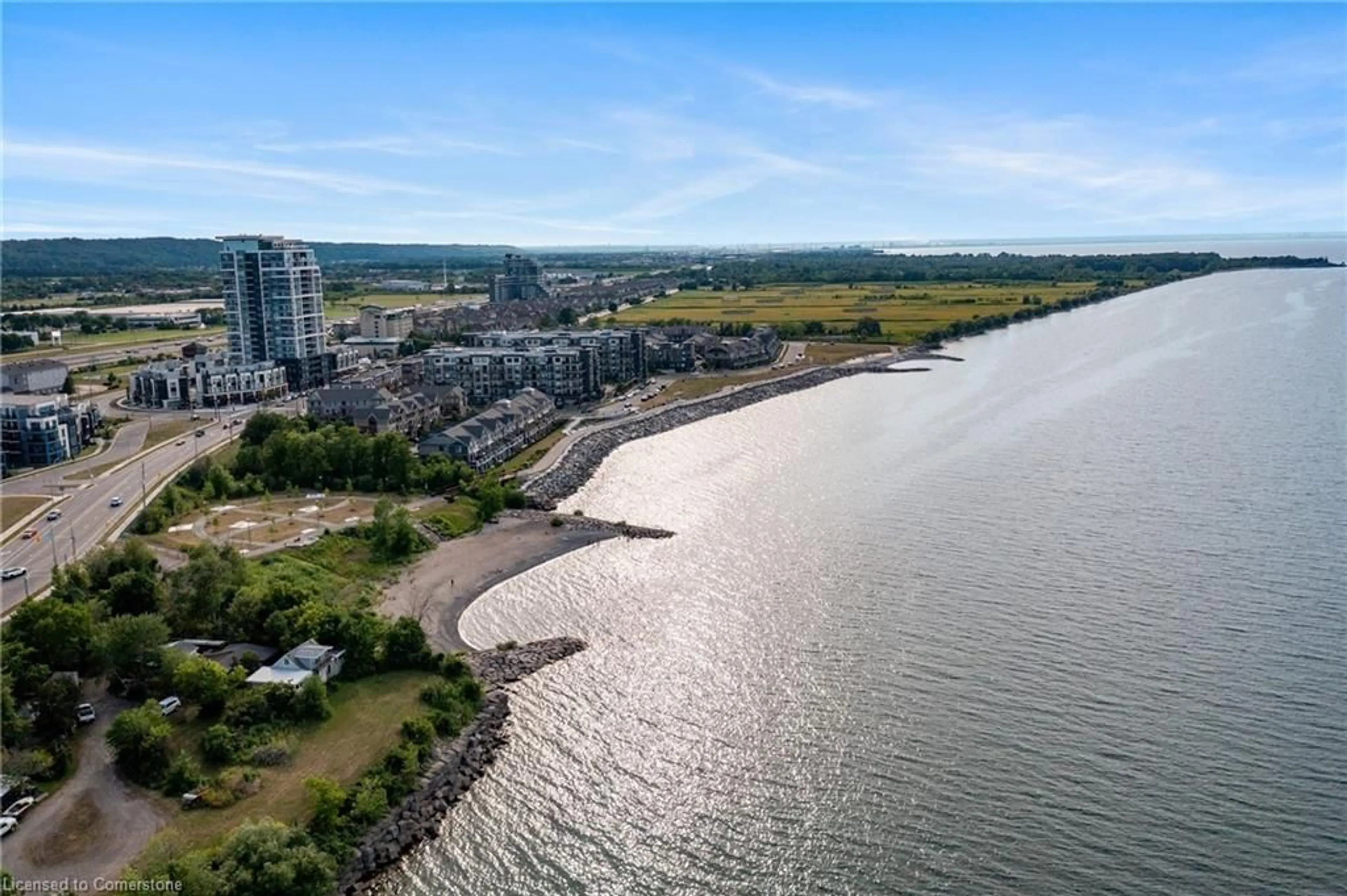 A pic from outside/outdoor area/front of a property/back of a property/a pic from drone, water/lake/river/ocean view for 385 Winston Rd #1205, Grimsby Ontario L3M 4E8
