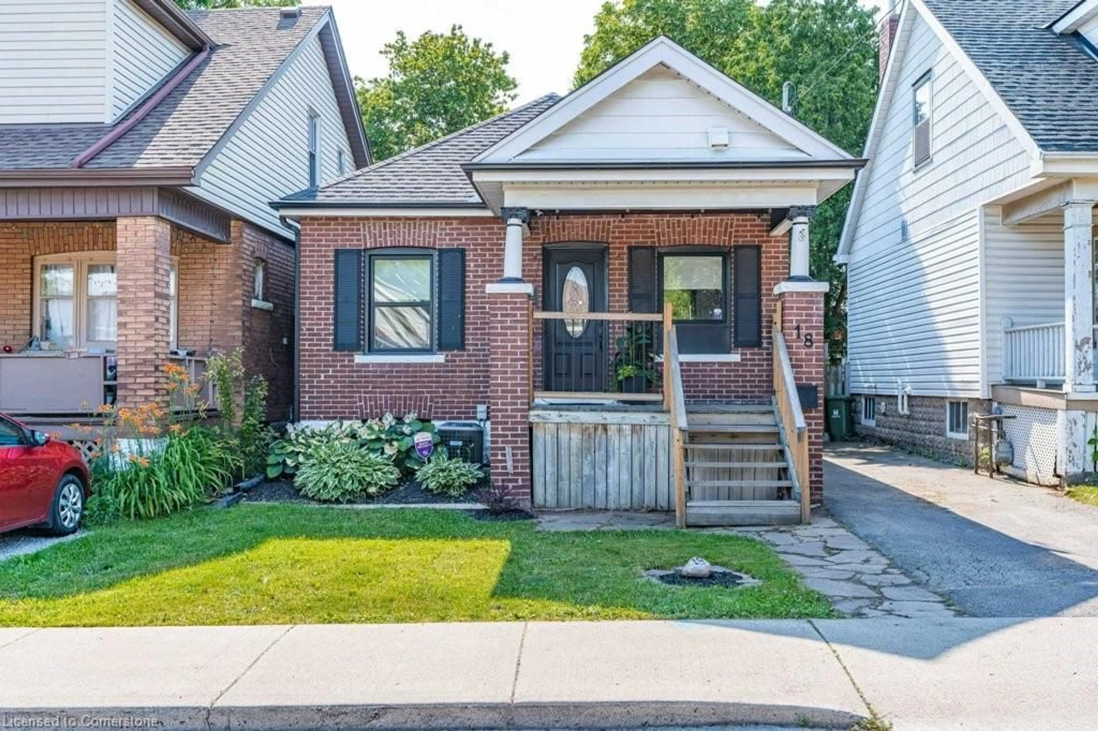 Home with brick exterior material, street for 18 Park Row, Hamilton Ontario L8H 4E4