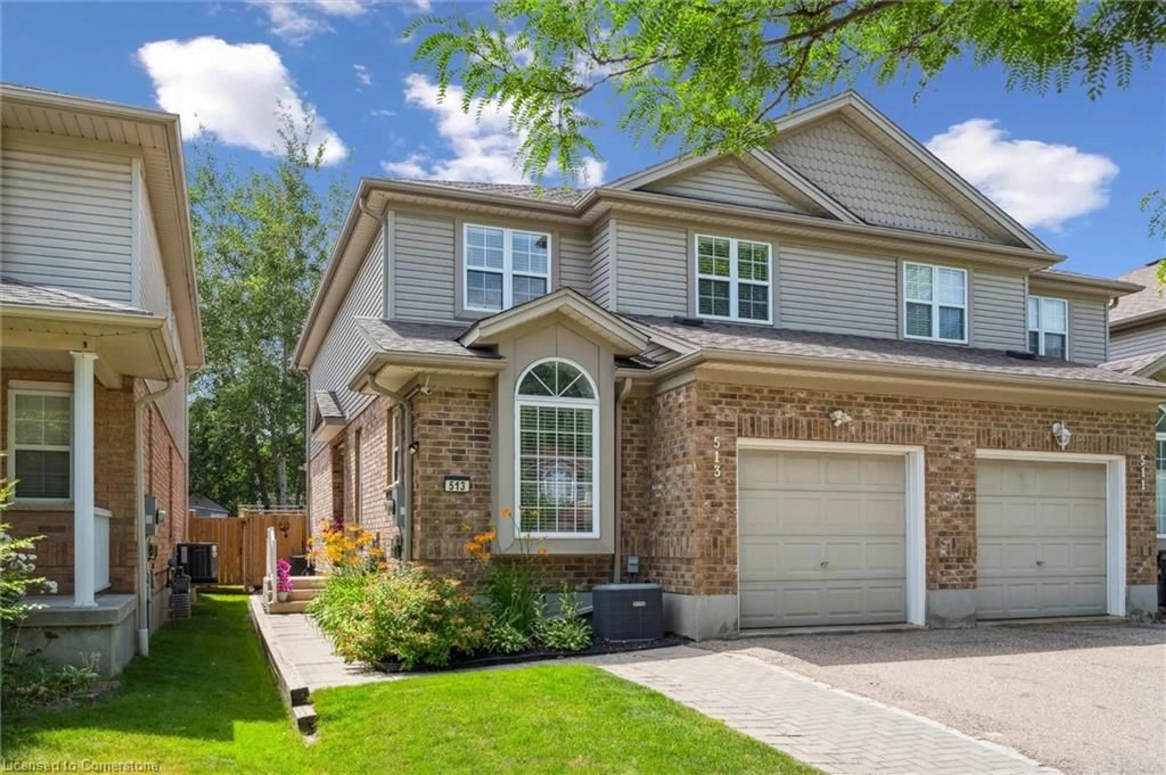 Home with brick exterior material, street for 513 Dansbury Dr, Waterloo Ontario N2K 4K8