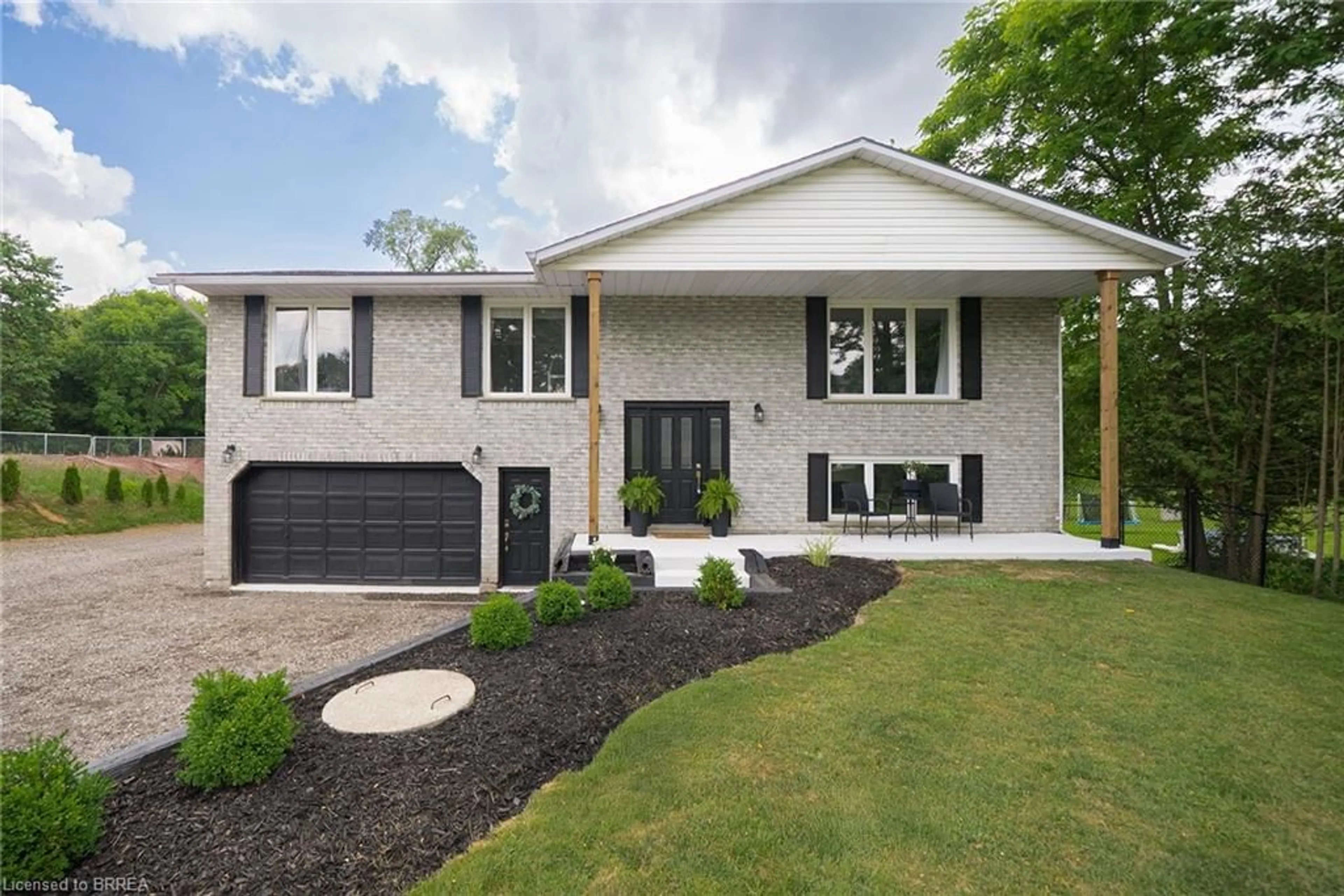 Home with brick exterior material, street for 1980 Old Highway 24, Wilsonville Ontario N0E 1Z0