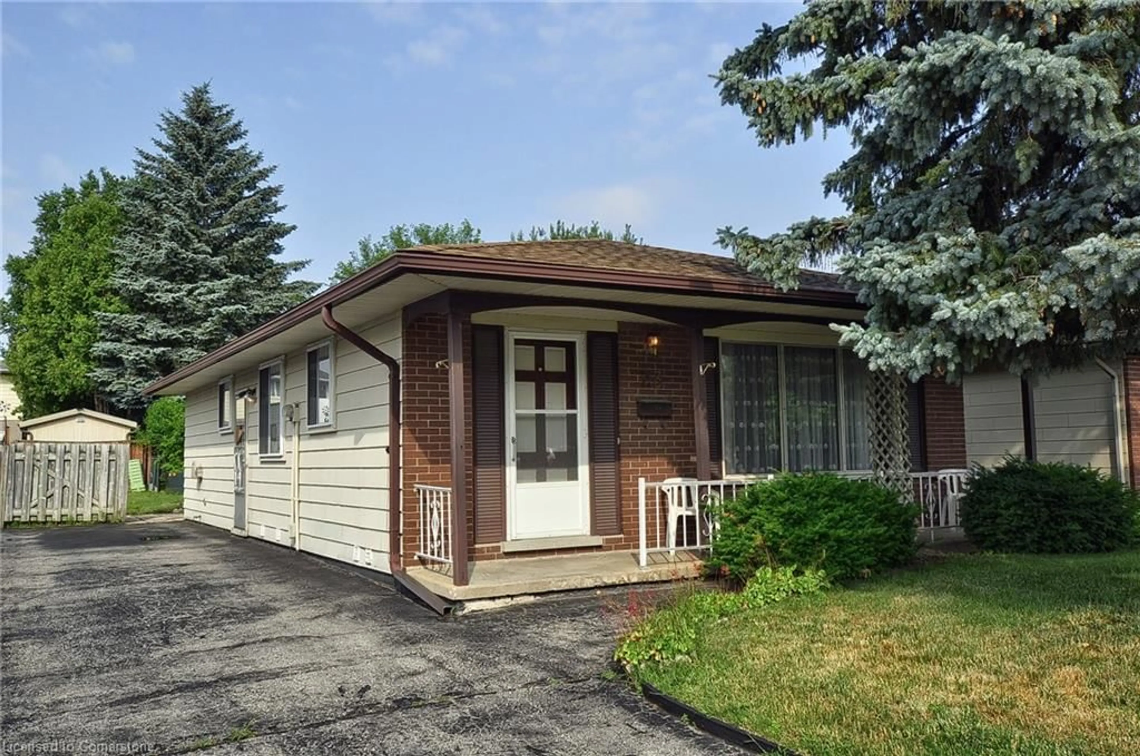 Home with vinyl exterior material, street for 23 Gibson Crt, Kitchener Ontario N2B 2P1